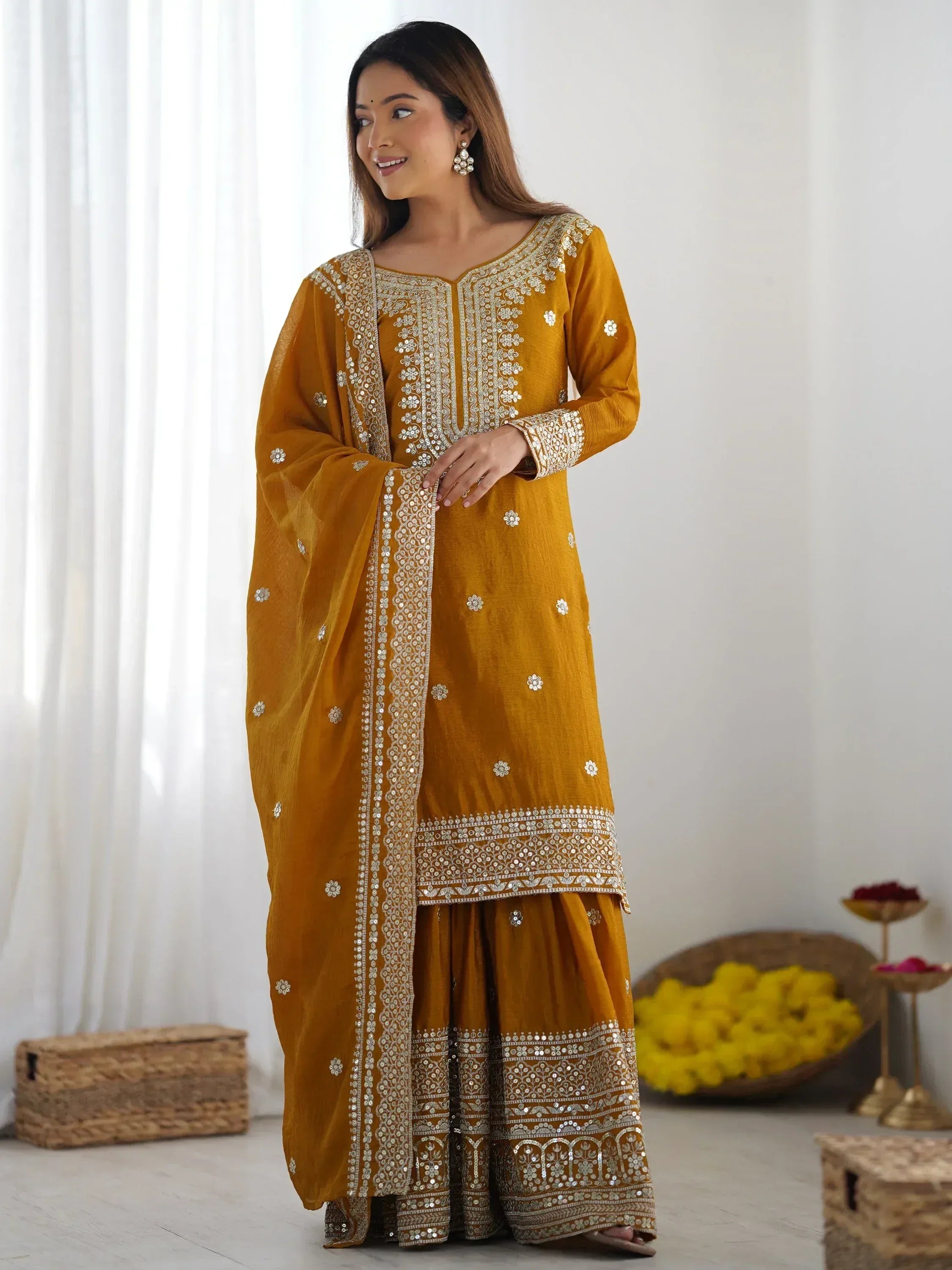 Mustard yellow embroidered salwar kameez with mirror work, perfect for Indian ethnic occasions
