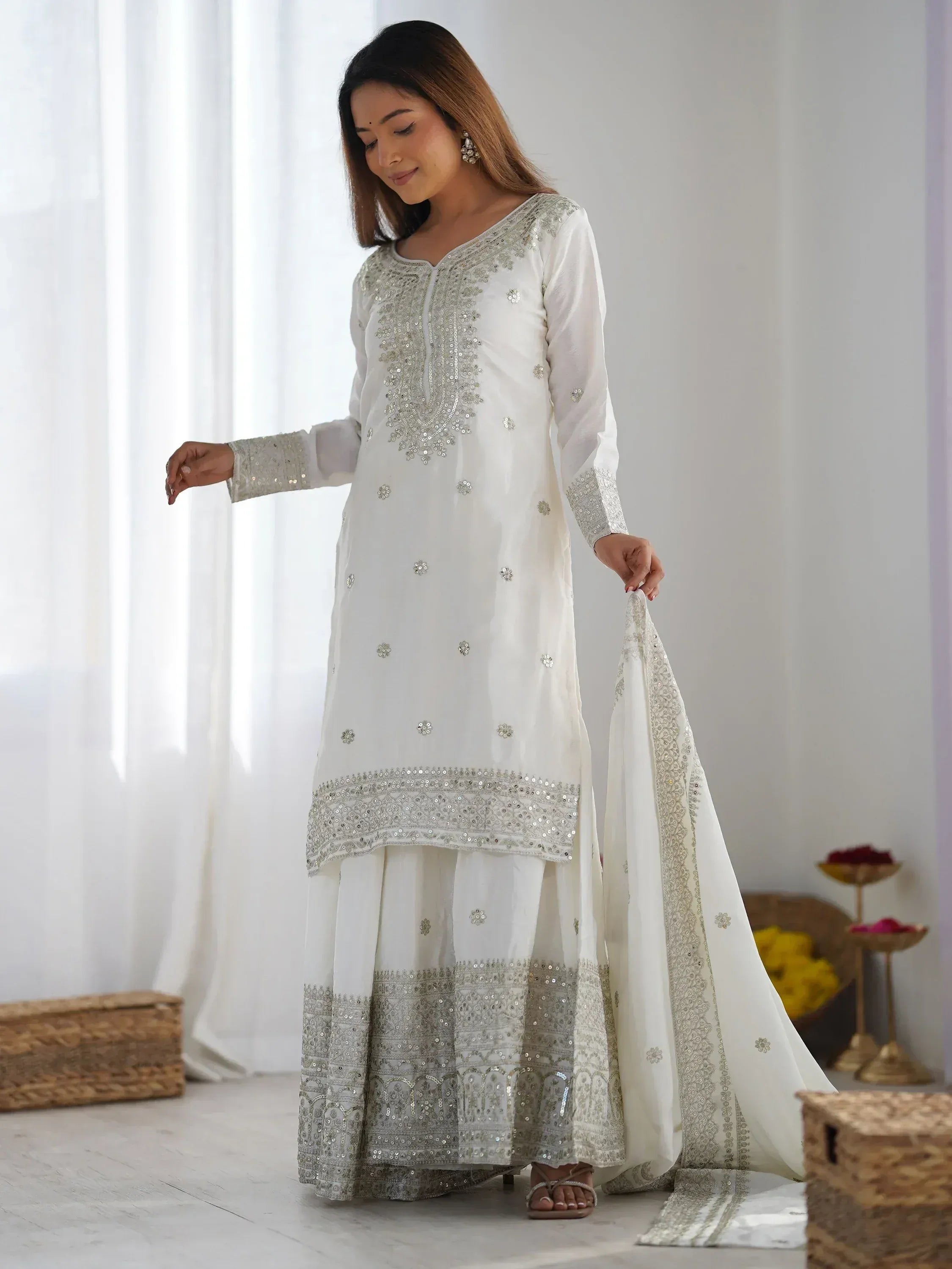 White embroidered salwar kameez with silver sequin work, perfect for Indian ethnic occasions