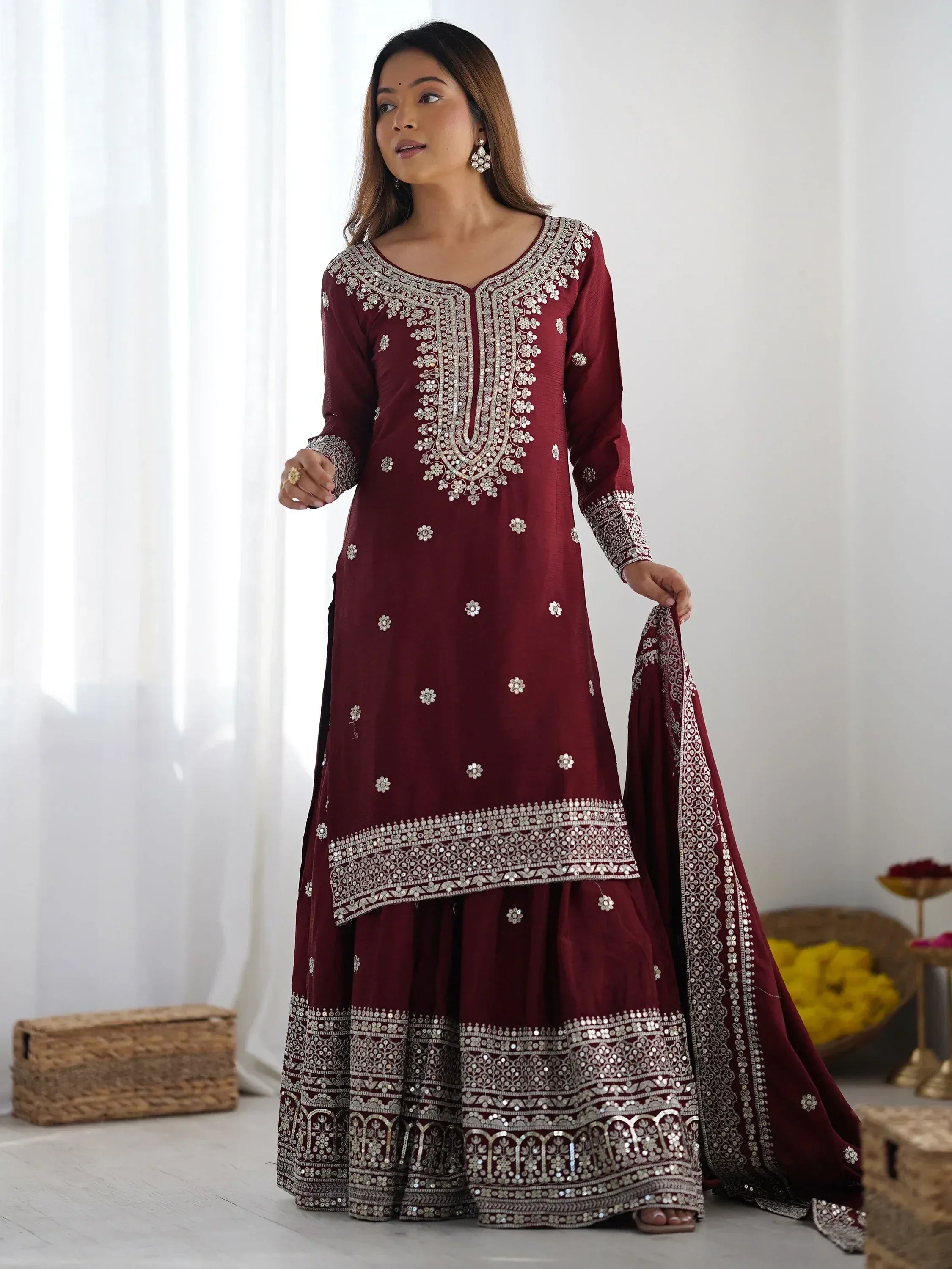 Maroon ethnic anarkali with silver embroidery and mirror work, perfect for Indian weddings and festive occasions.