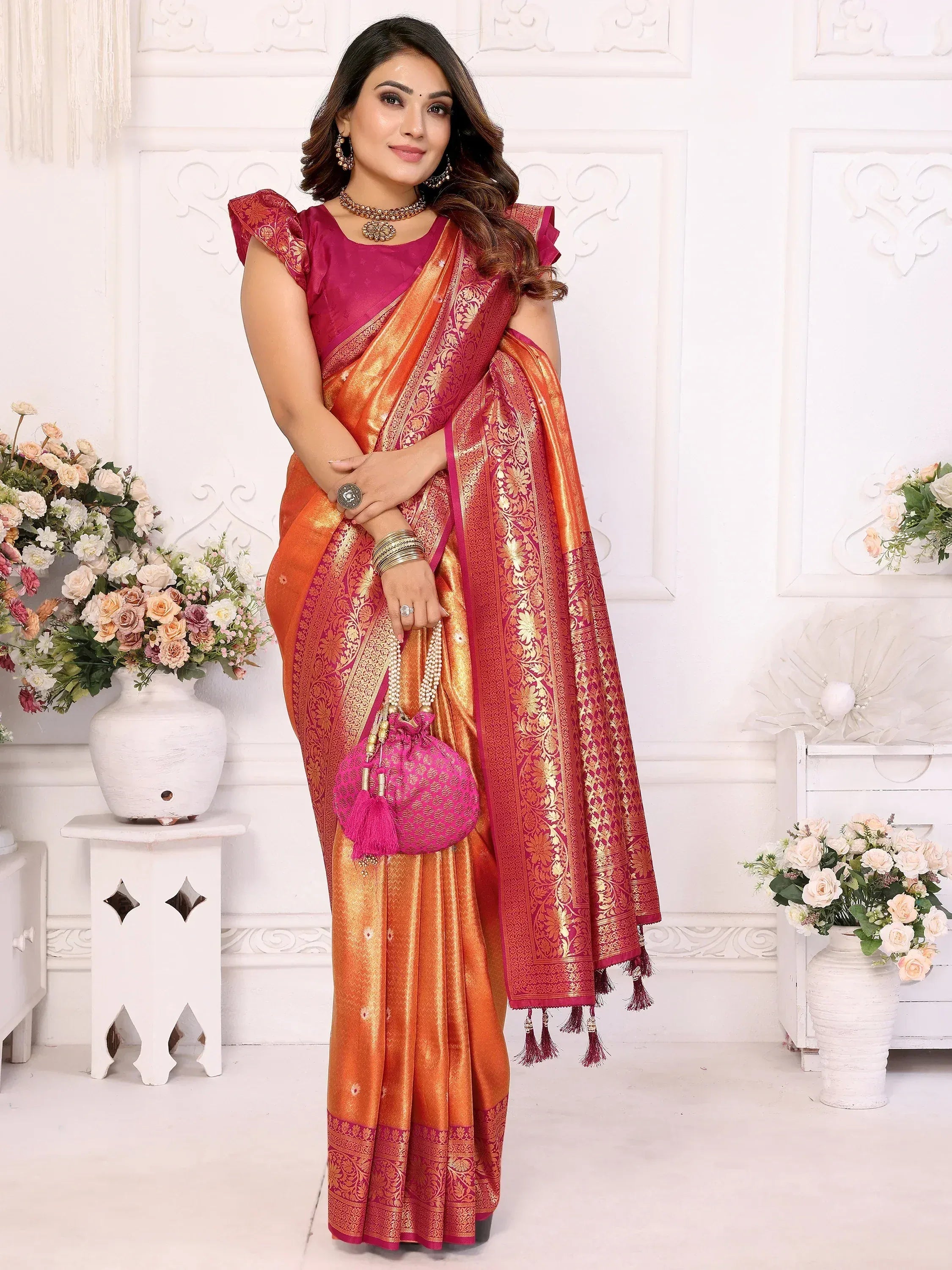 Orange and pink designer saree with gold zari work, perfect for Indian ethnic wear occasions