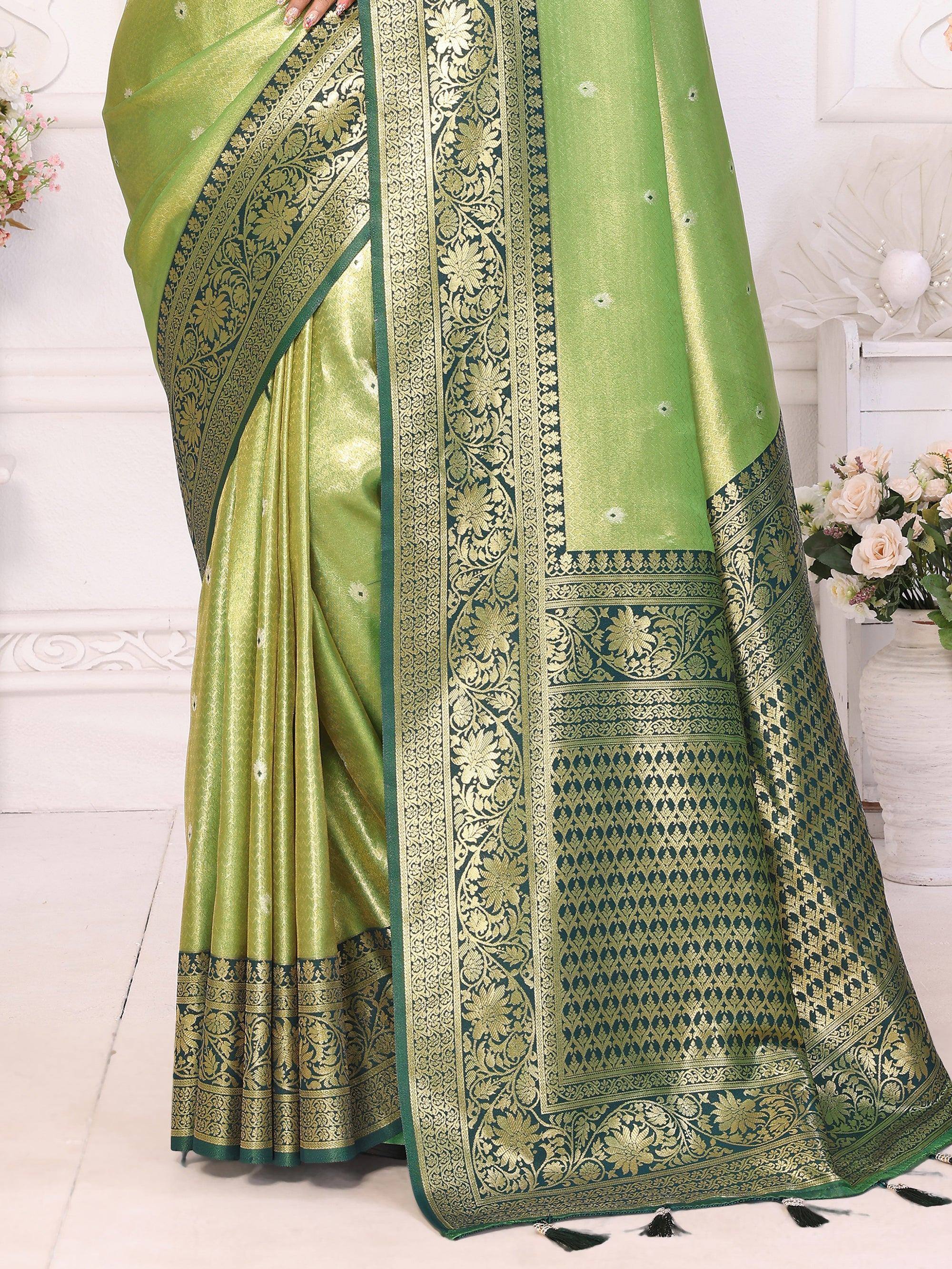 Green silk saree with gold floral border, perfect for ethnic occasions