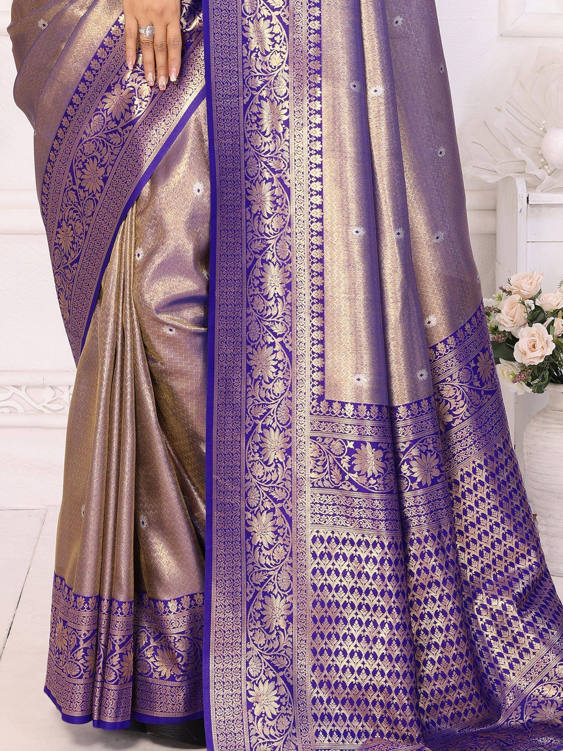 Purple and gold designer saree with intricate floral zari border, perfect for ethnic occasions