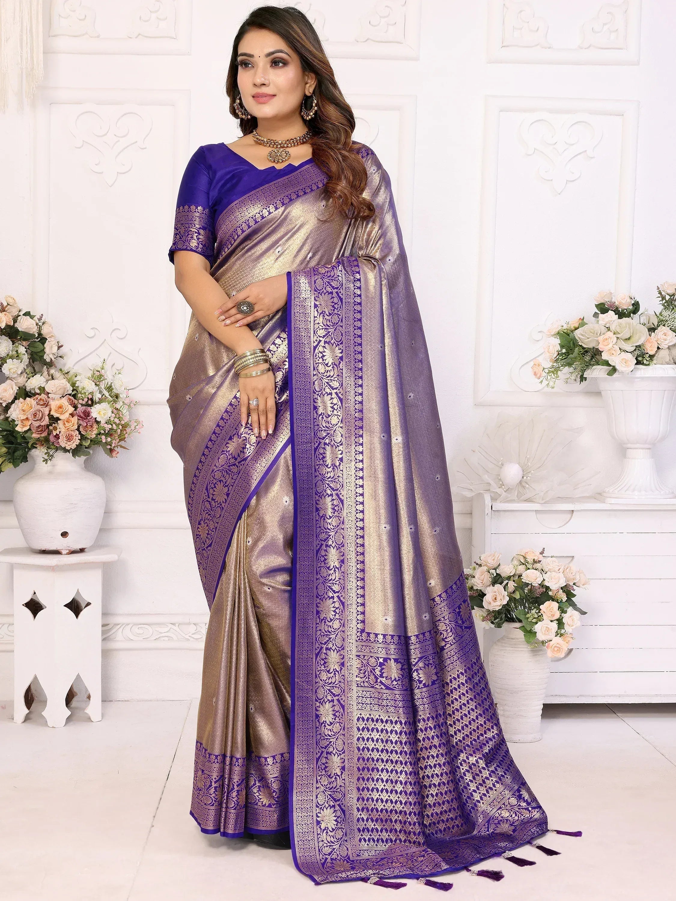 Elegant purple and gold saree with intricate embroidery and border designs, perfect for festive occasions.