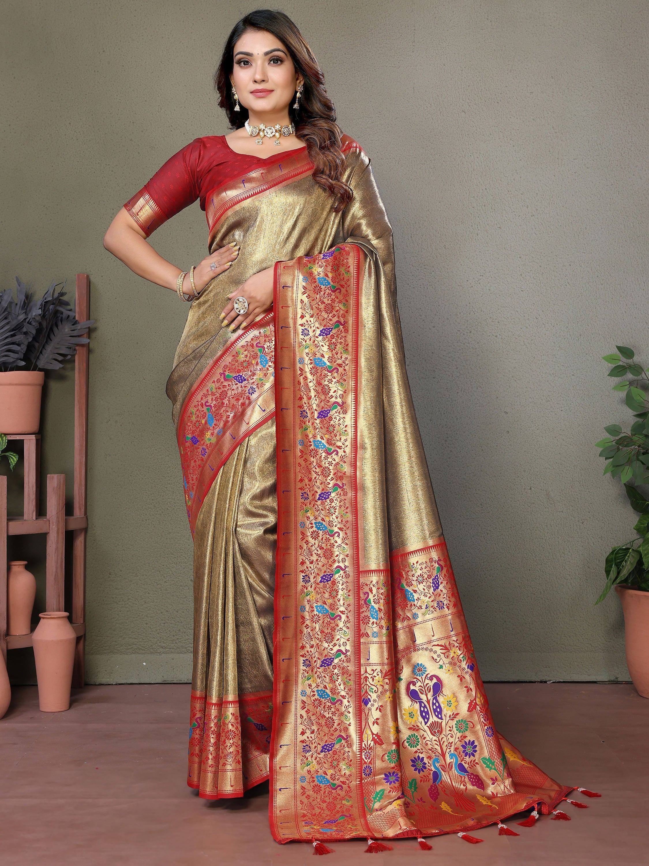 Golden saree with colorful peacock and floral embroidery, paired with red blouse for festive occasions