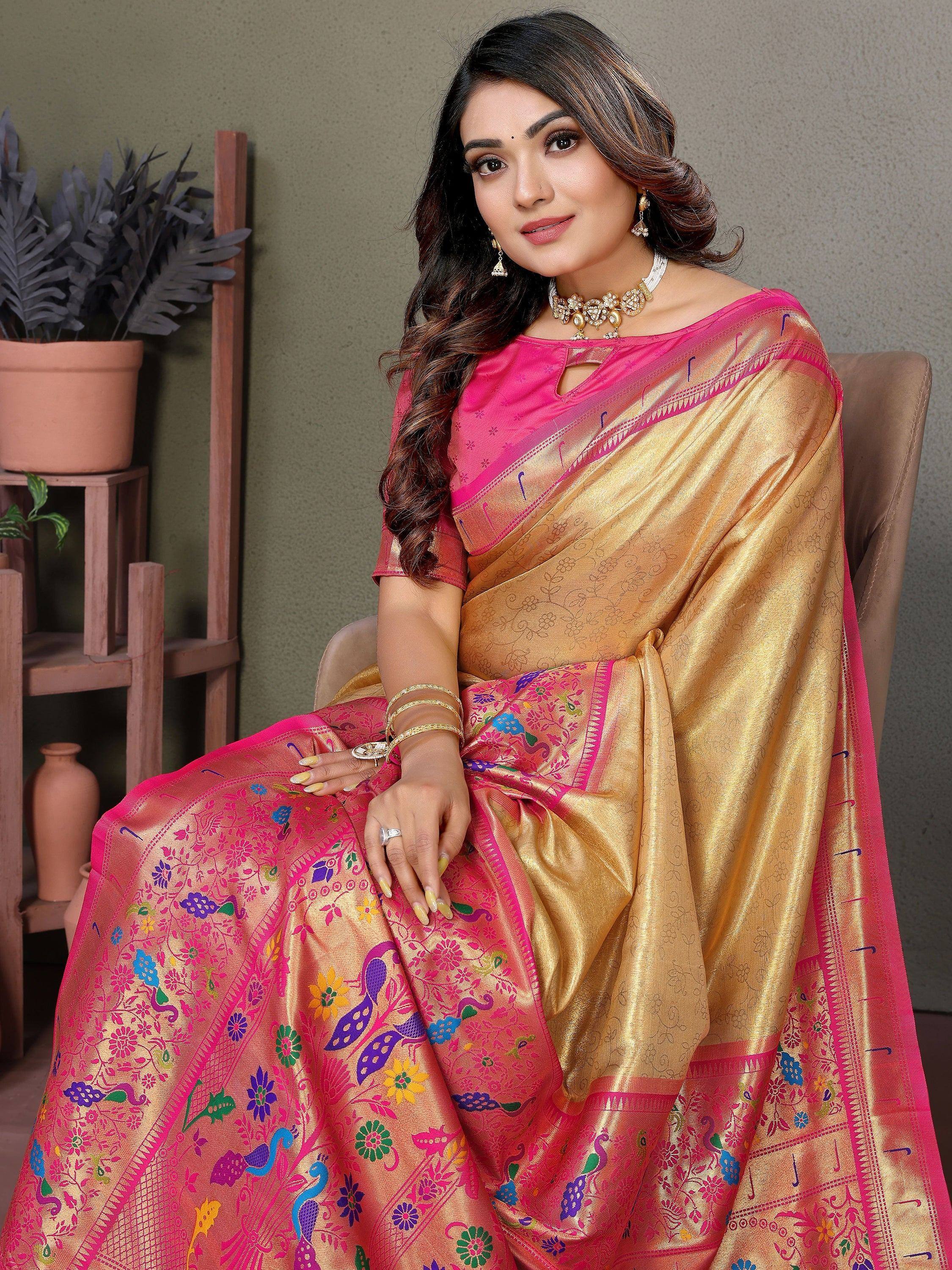 Elegant pink and gold saree with peacock and floral embroidery, perfect for Indian ethnic wear.
