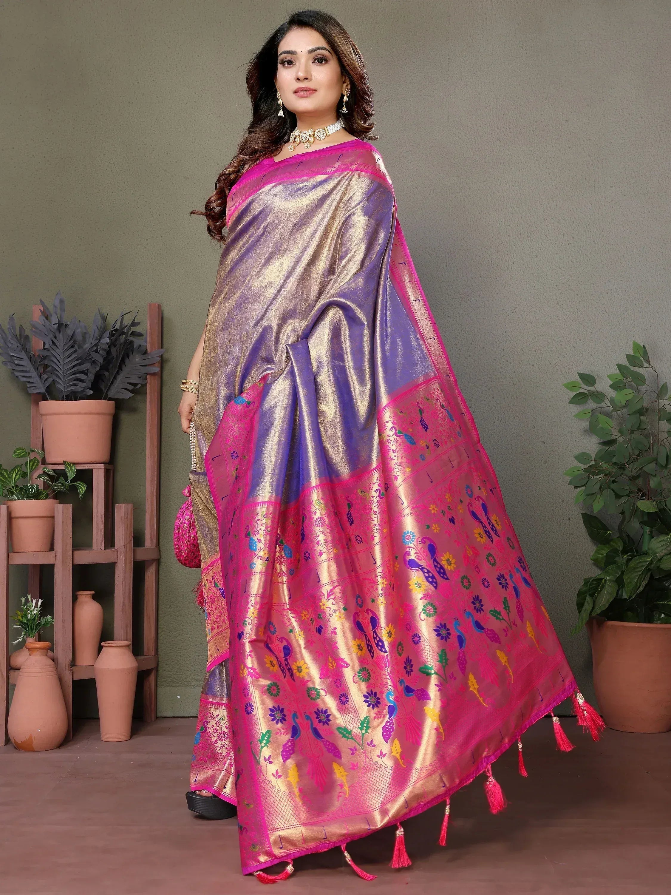 Elegant purple and pink saree with peacock and floral embroidery, perfect for Indian ethnic wear.