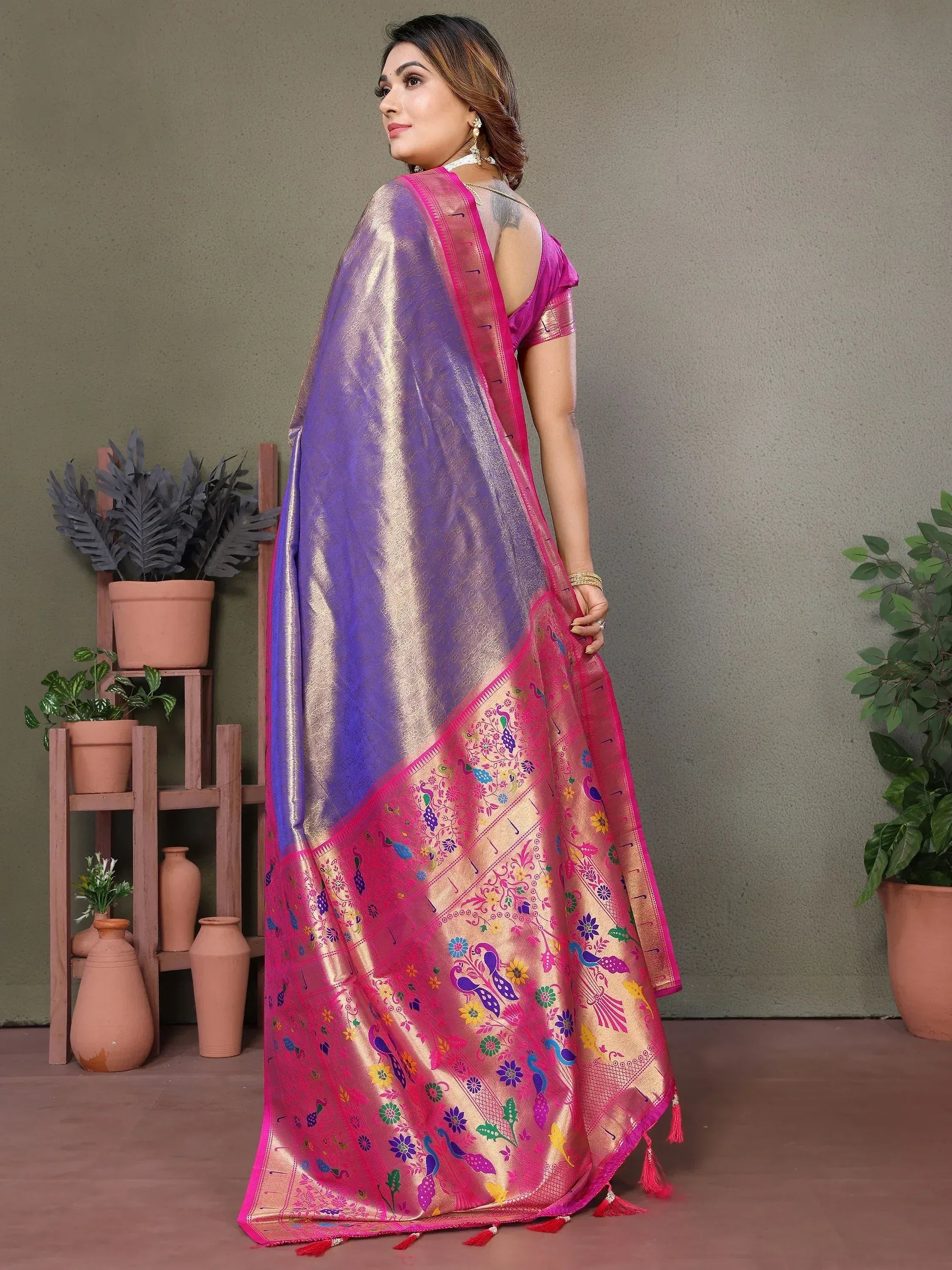 Purple and pink designer saree with peacock and floral motifs, perfect for ethnic occasions