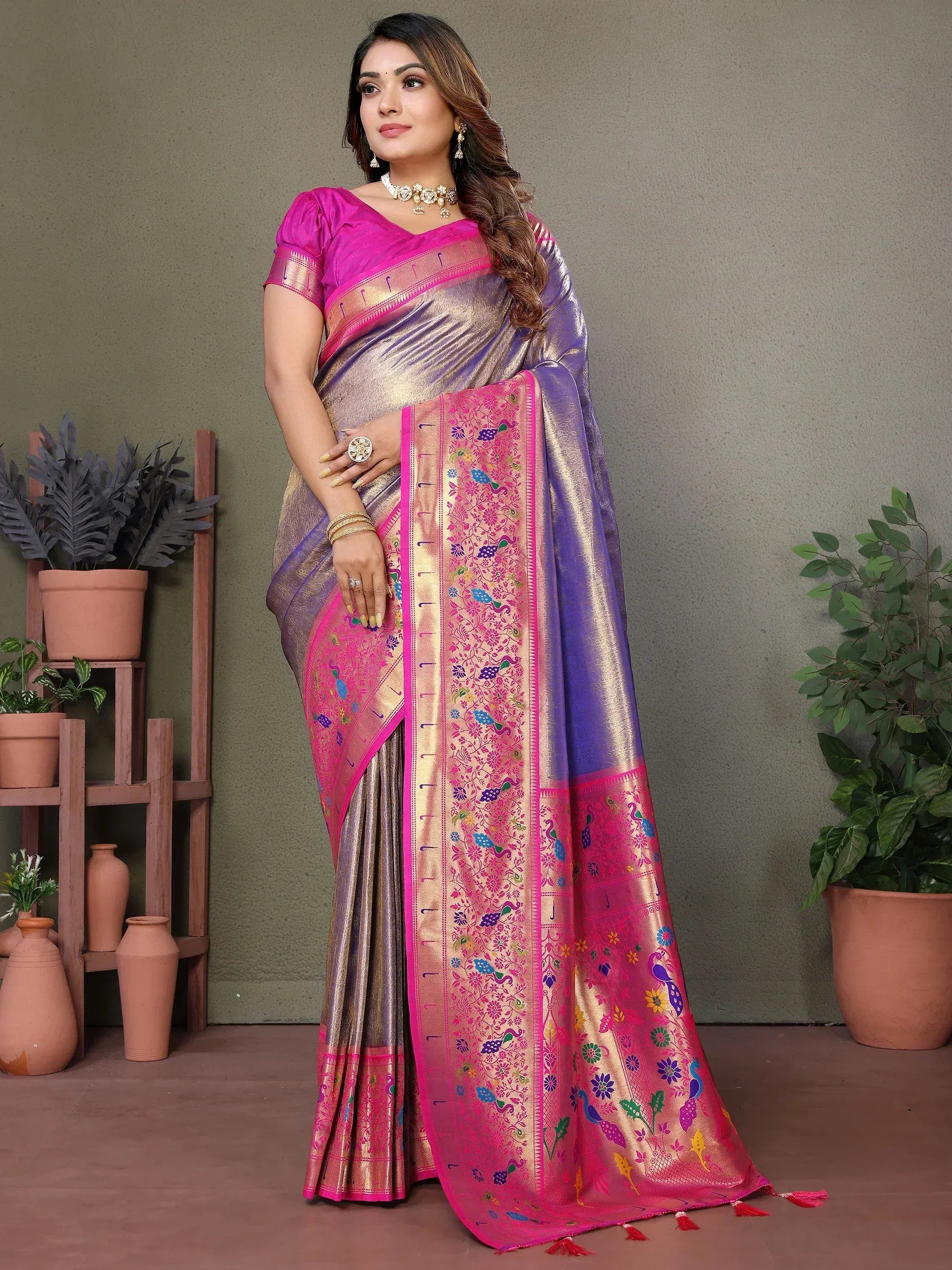 Elegant pink and purple saree with peacock embroidery, perfect for Indian ethnic wear occasions.