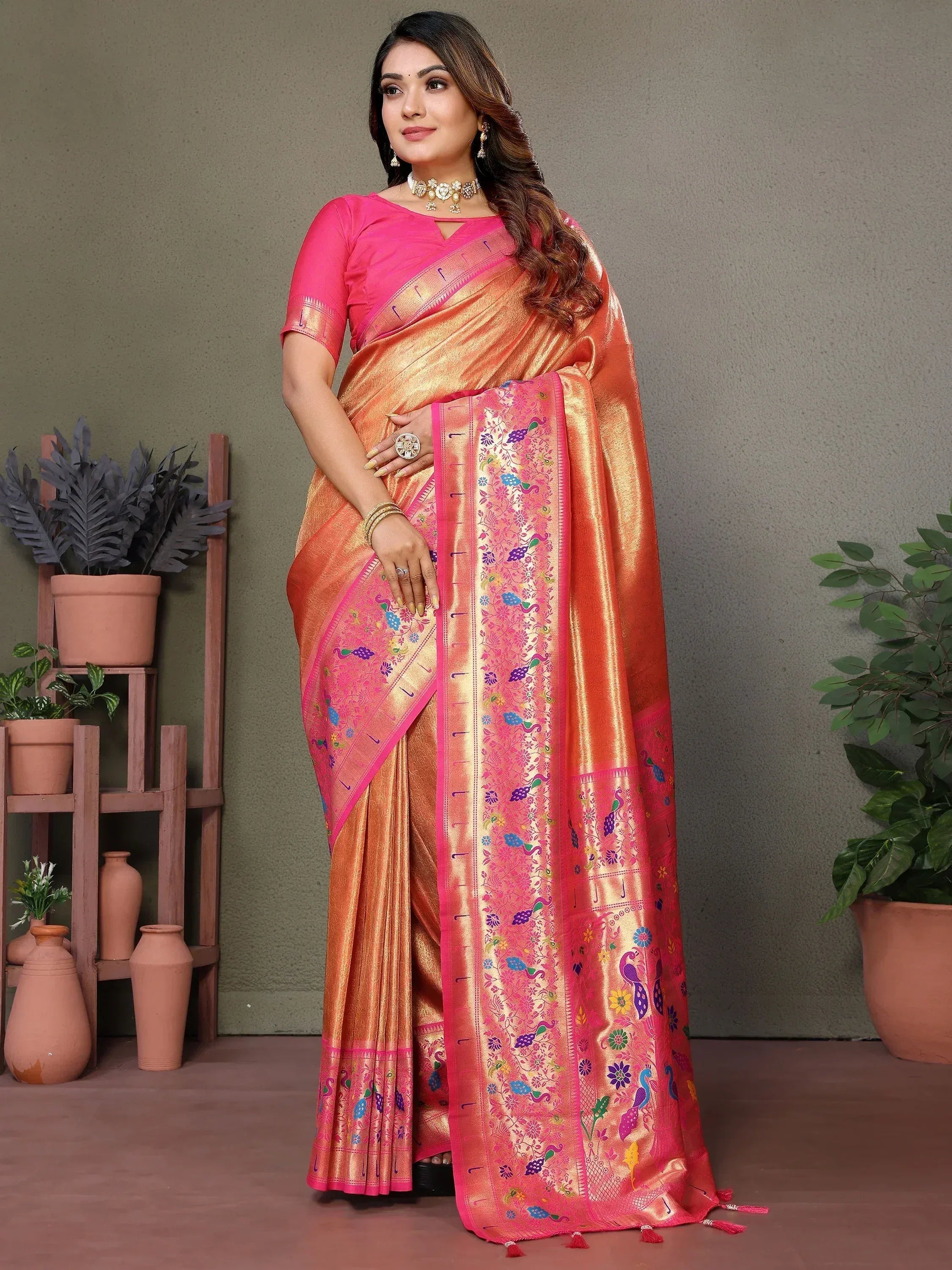 Elegant peach and pink saree with peacock embroidery, perfect for Indian ethnic wear occasions.
