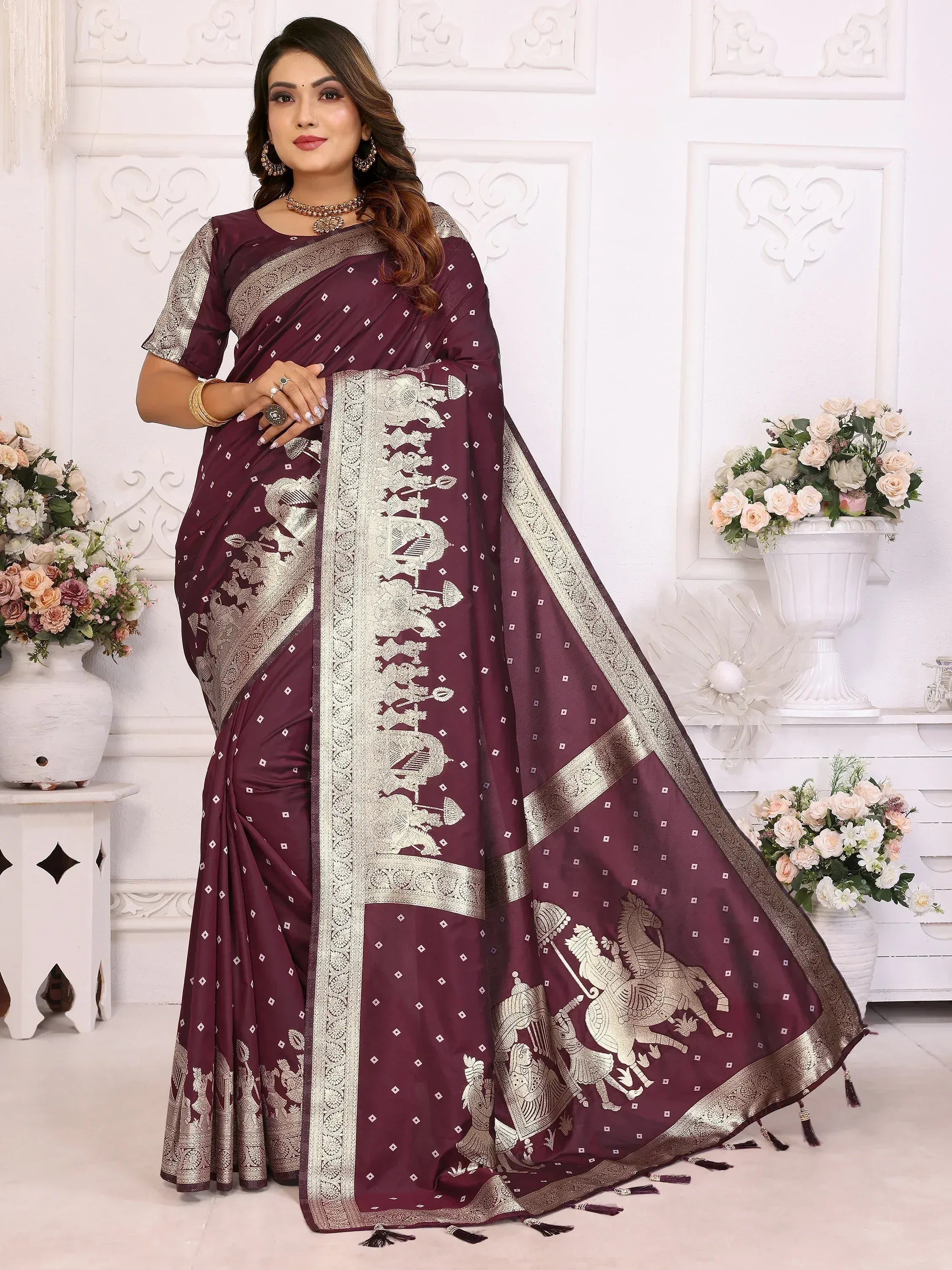 Elegant maroon saree with golden horse motifs and intricate borders, perfect for ethnic occasions.