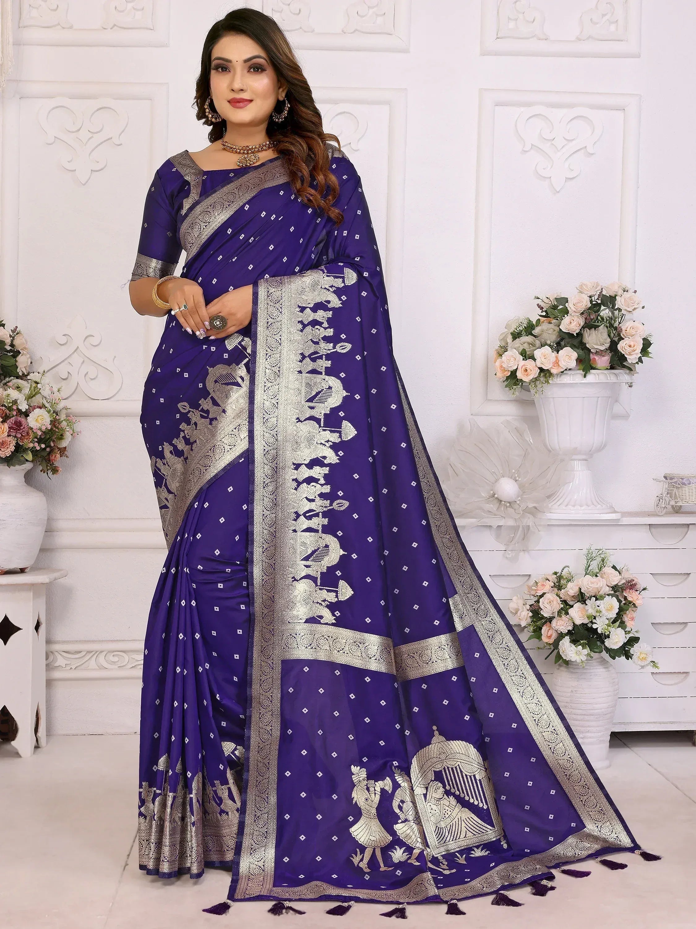 Elegant purple saree with silver zari work and traditional motifs, perfect for Indian ethnic wear.