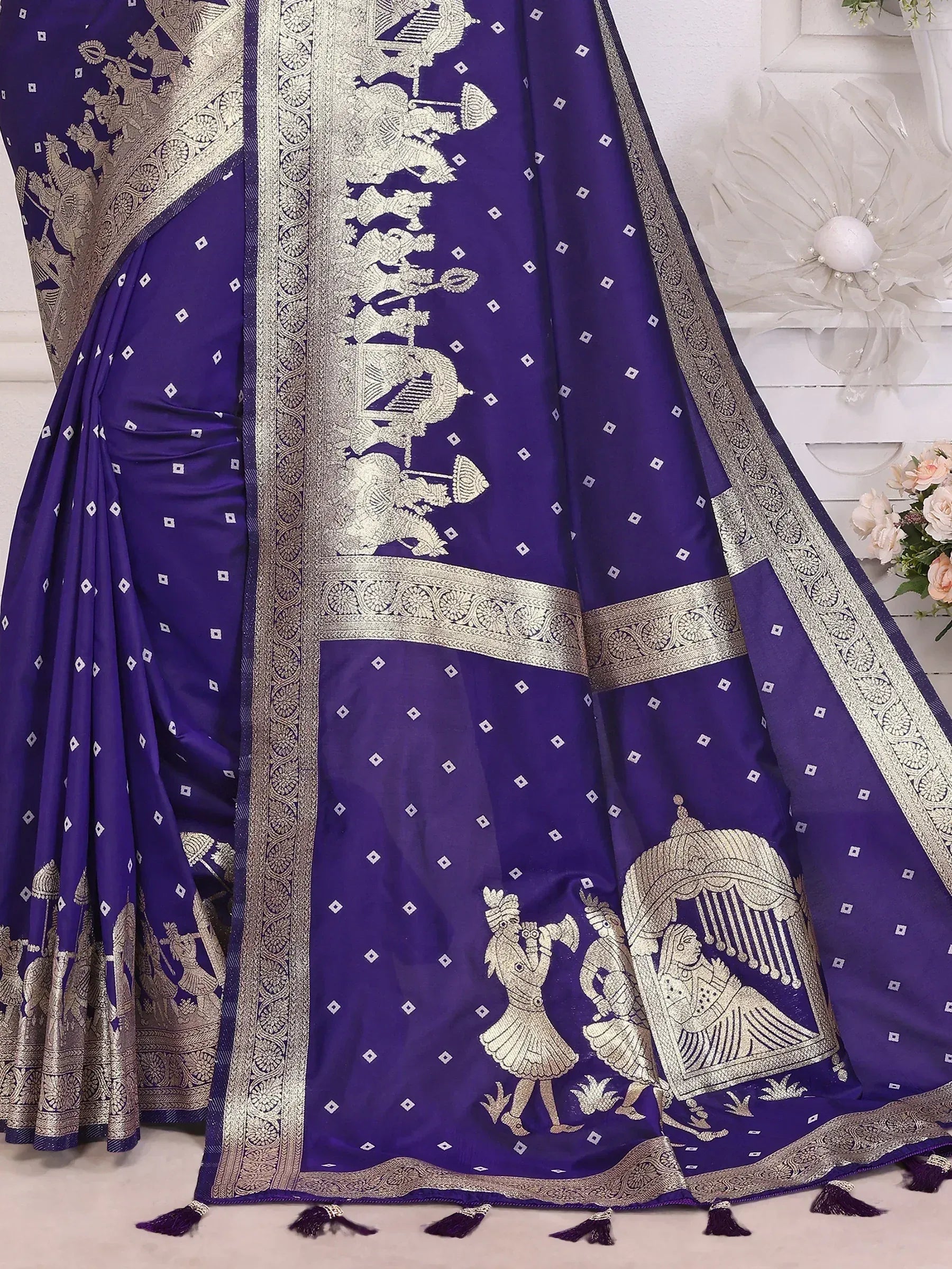 Purple saree with gold embroidery and traditional motifs, perfect for ethnic wear