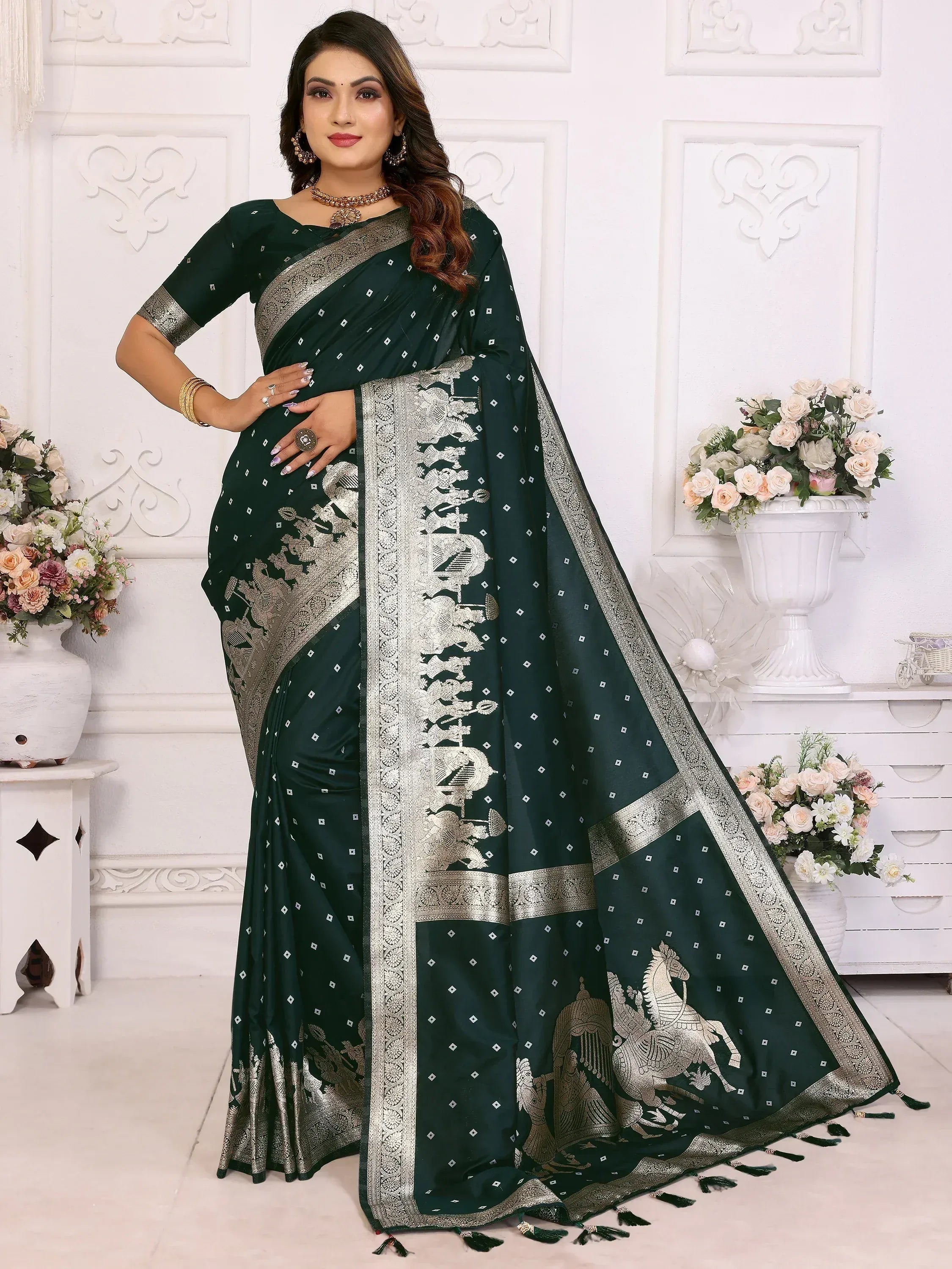 Elegant dark green saree with silver horse motifs and intricate borders, perfect for ethnic occasions.