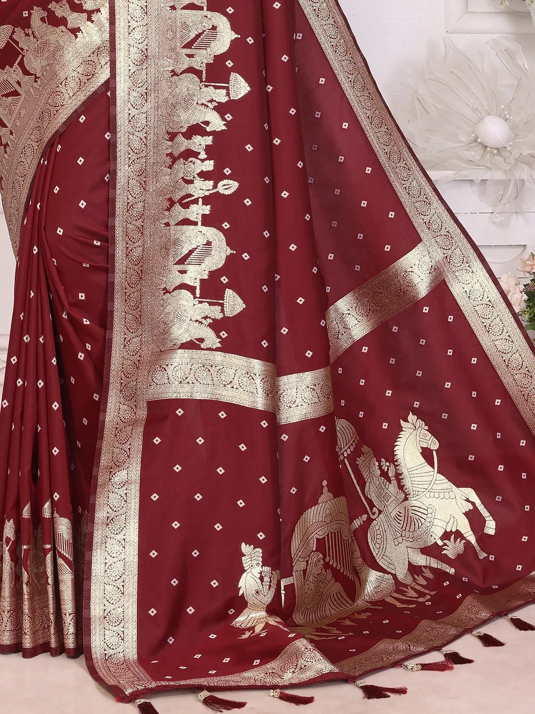 Maroon saree with gold horse and warrior motifs, perfect for ethnic occasions