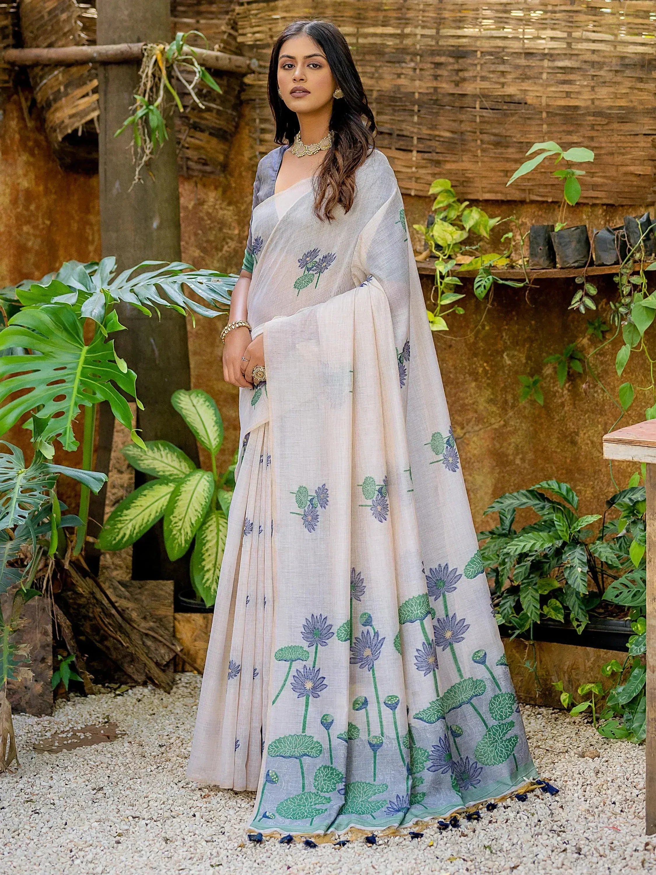 Elegant floral printed saree with purple and green lotus motifs, perfect for ethnic occasions