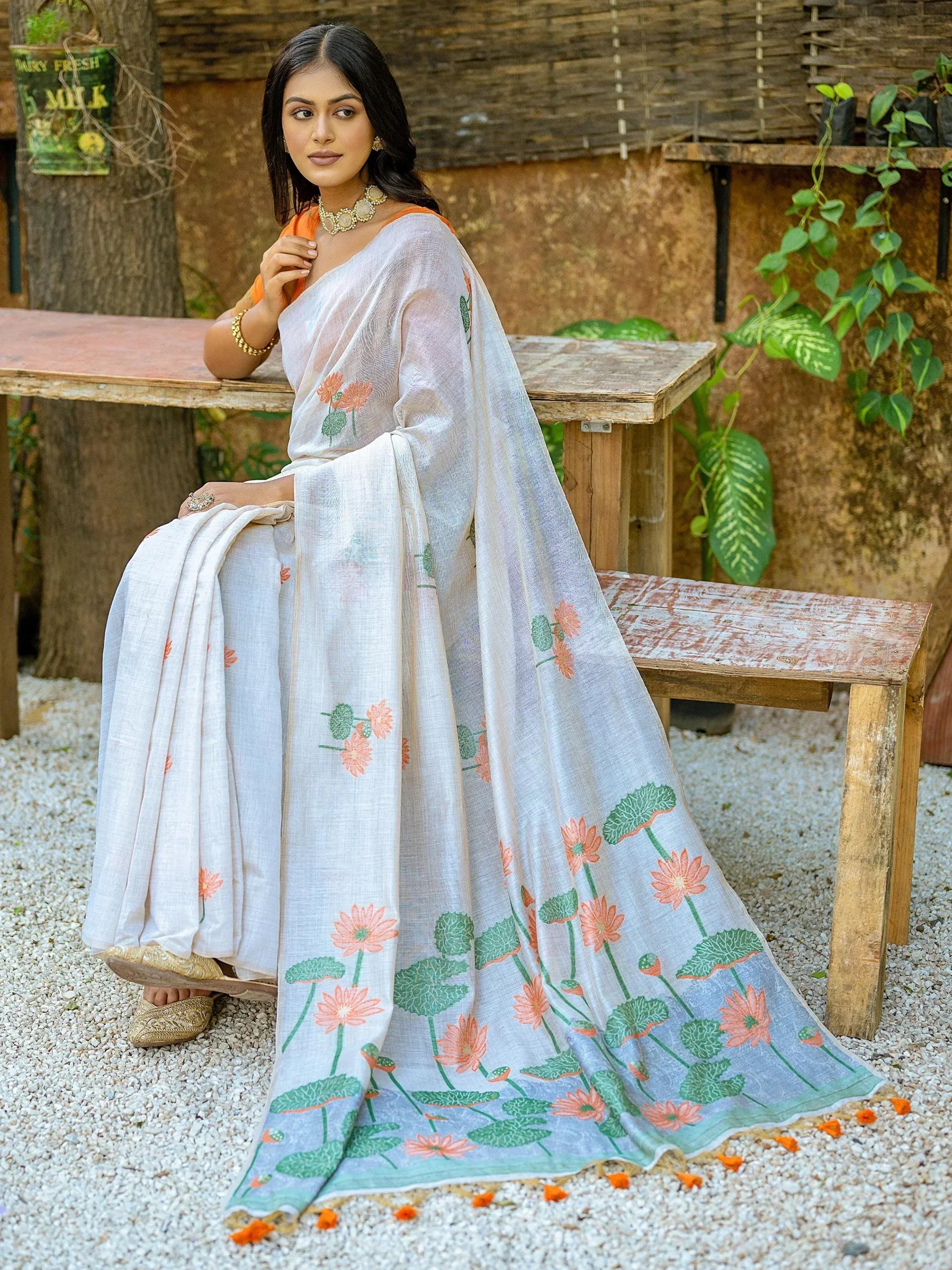 Elegant white saree with floral print, perfect for ethnic occasions