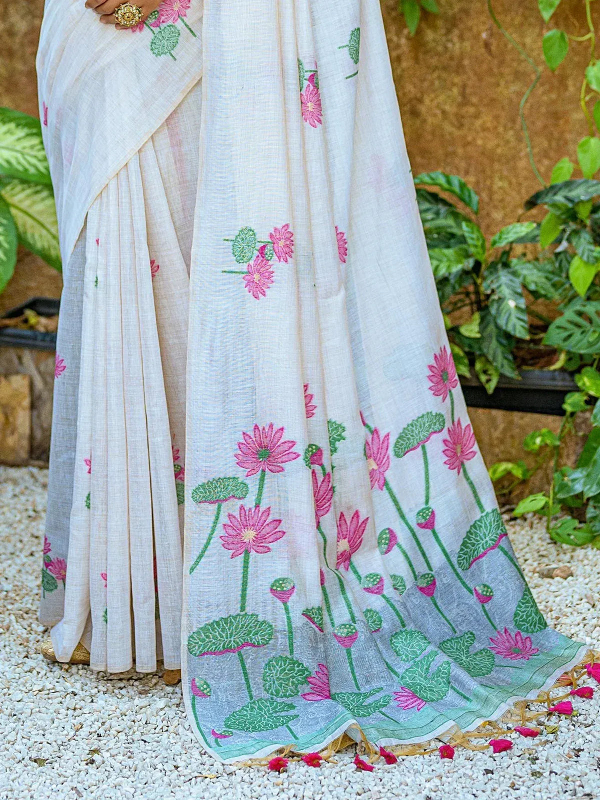 White saree with pink lotus print, perfect for ethnic wear and festive occasions