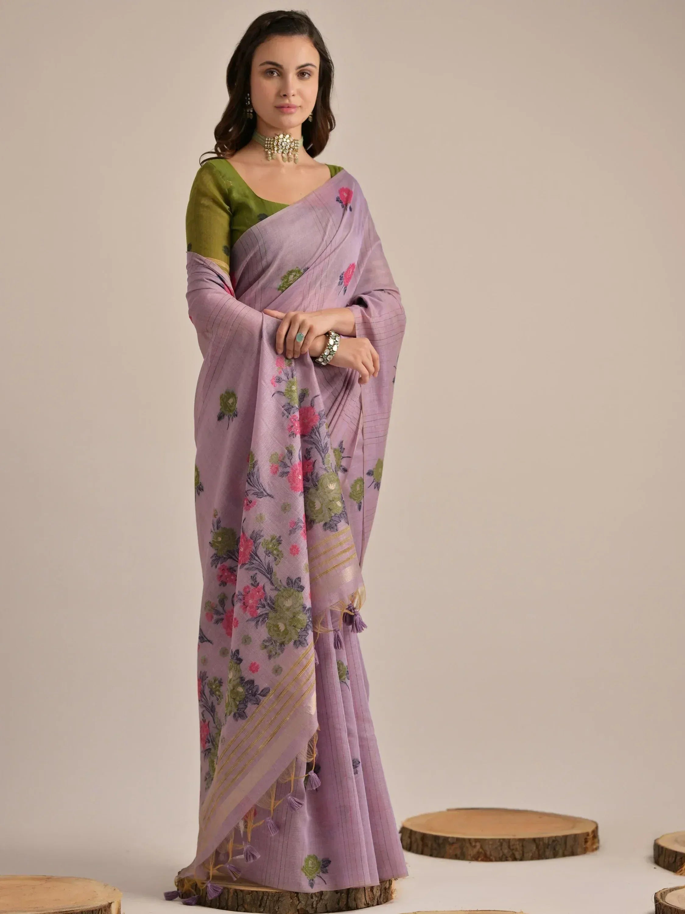 Purple floral saree with green blouse, perfect for ethnic wear occasions
