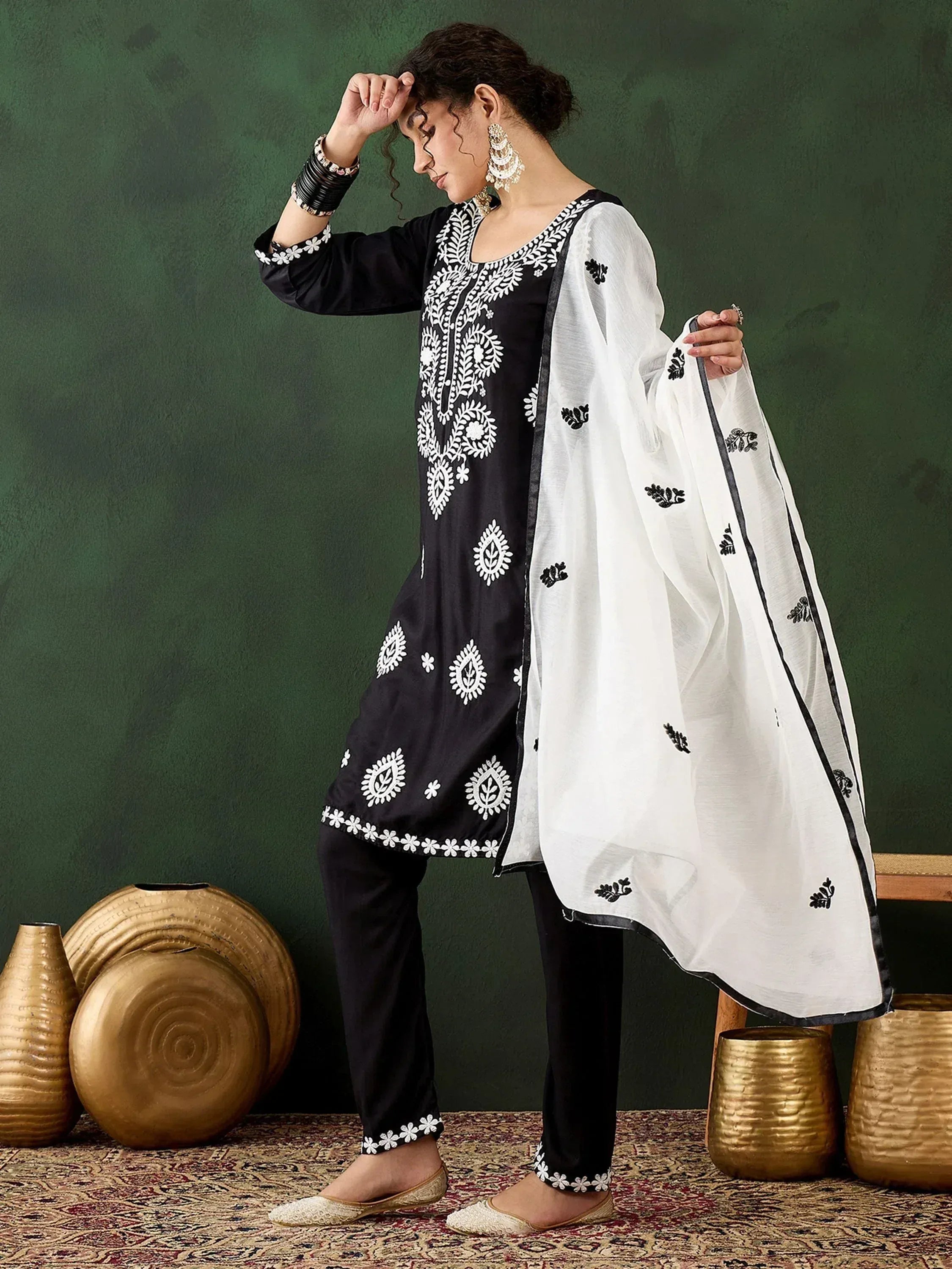 Black and white embroidered salwar kameez with floral patterns and matching dupatta