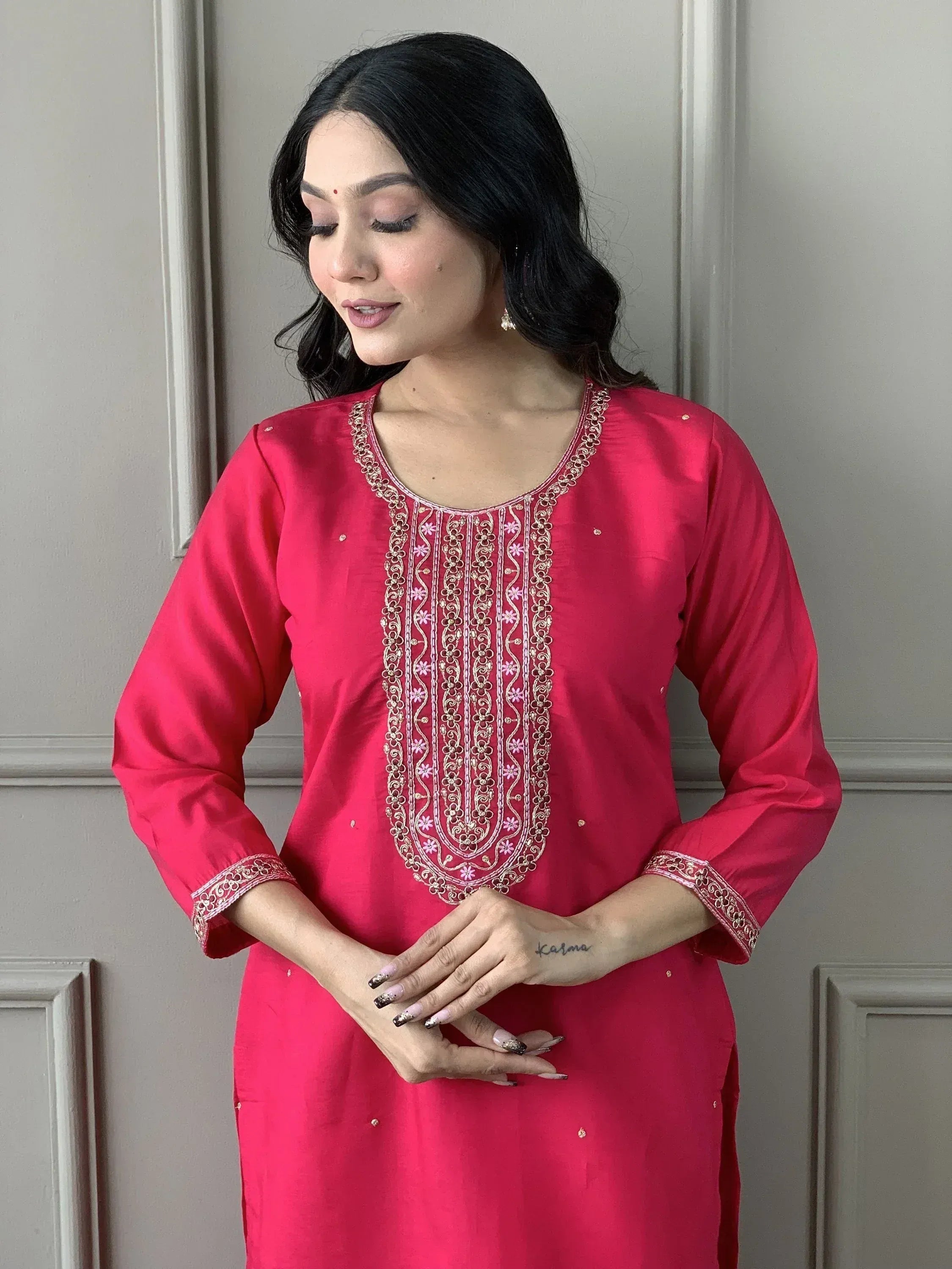 Pink embroidered kurta with gold and floral detailing, ideal for ethnic wear occasions