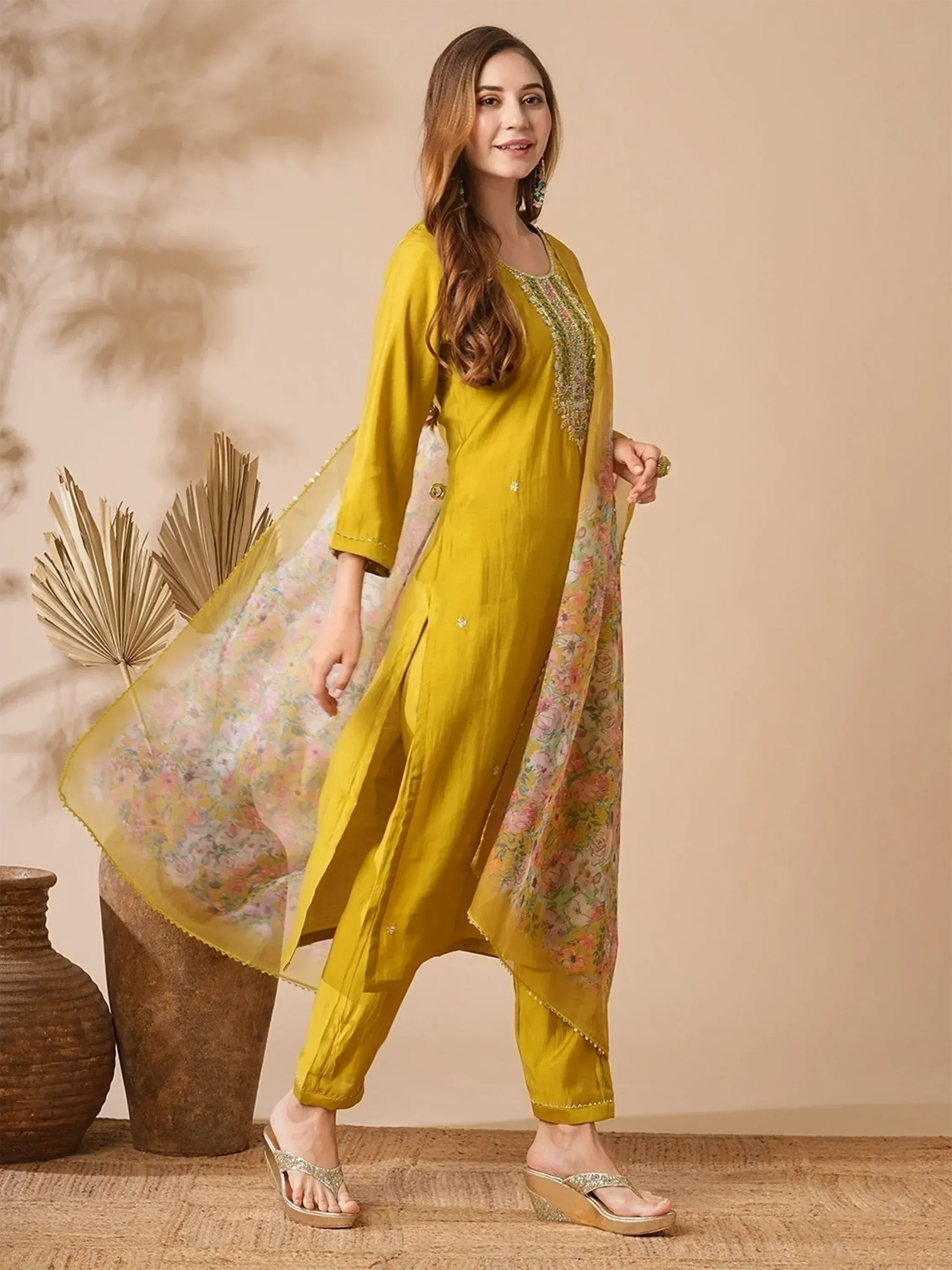 Yellow ethnic salwar kameez with floral dupatta, perfect for Indian wear and festive occasions
