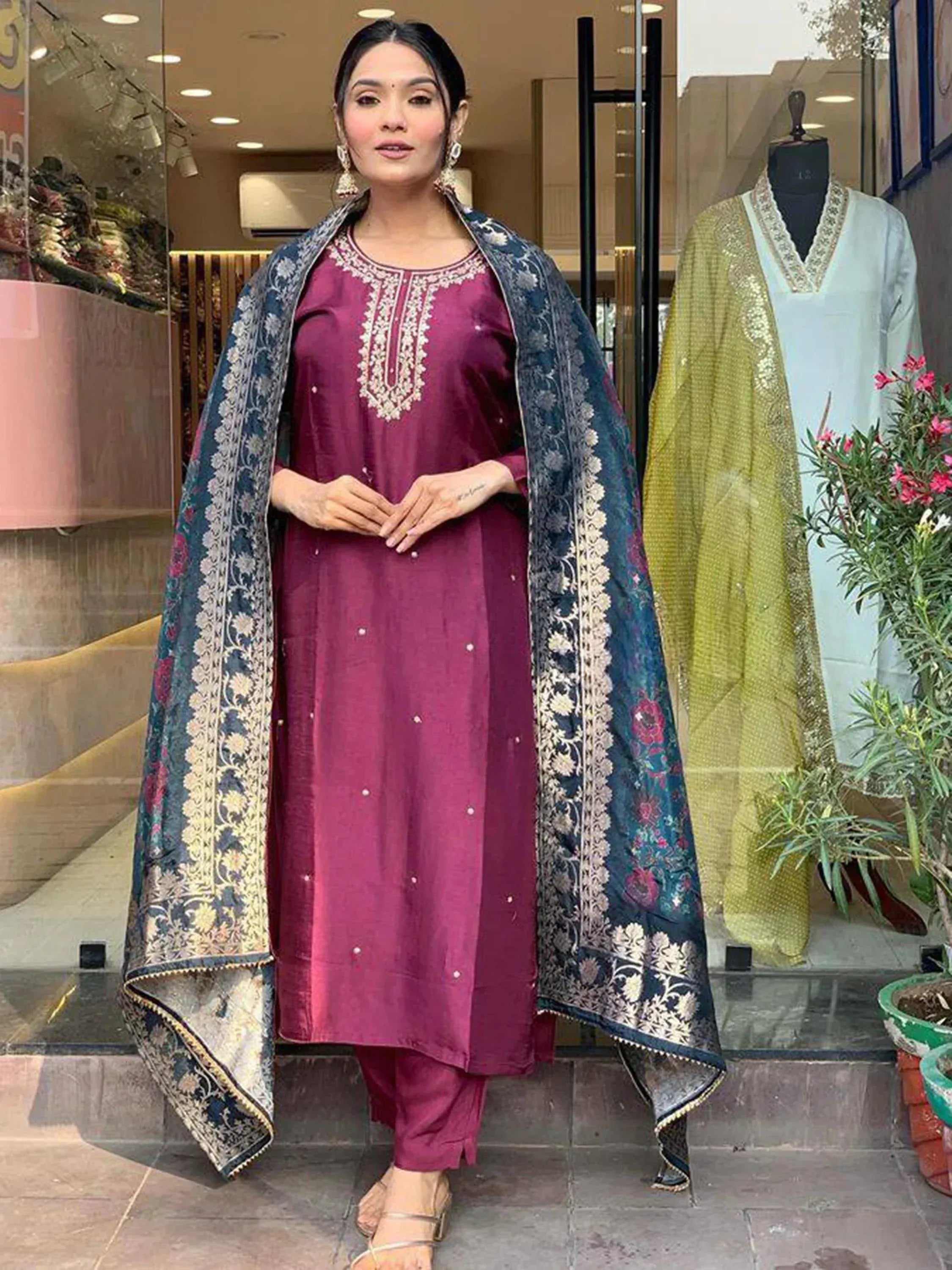 Woman in maroon embroidered kurta with floral dupatta, Indian ethnic wear