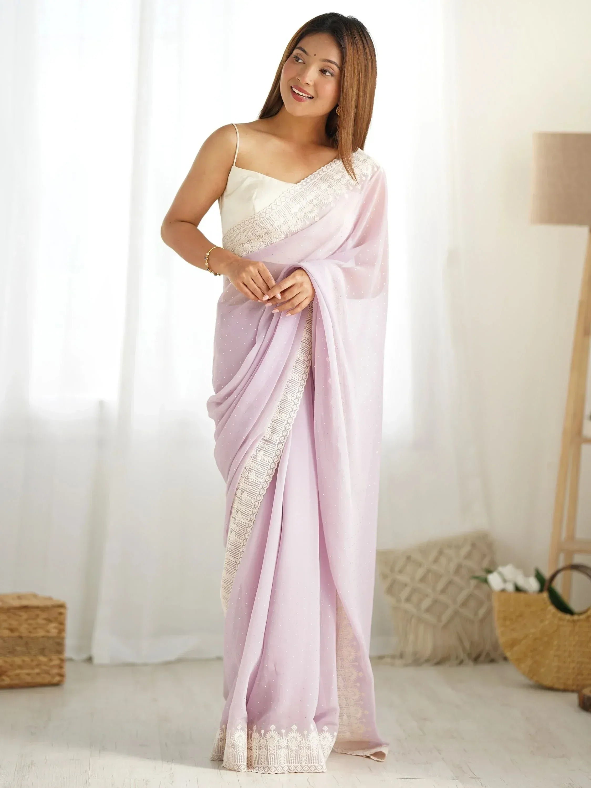 Woman in lavender saree with white lace border and embroidered blouse, Indian ethnic wear