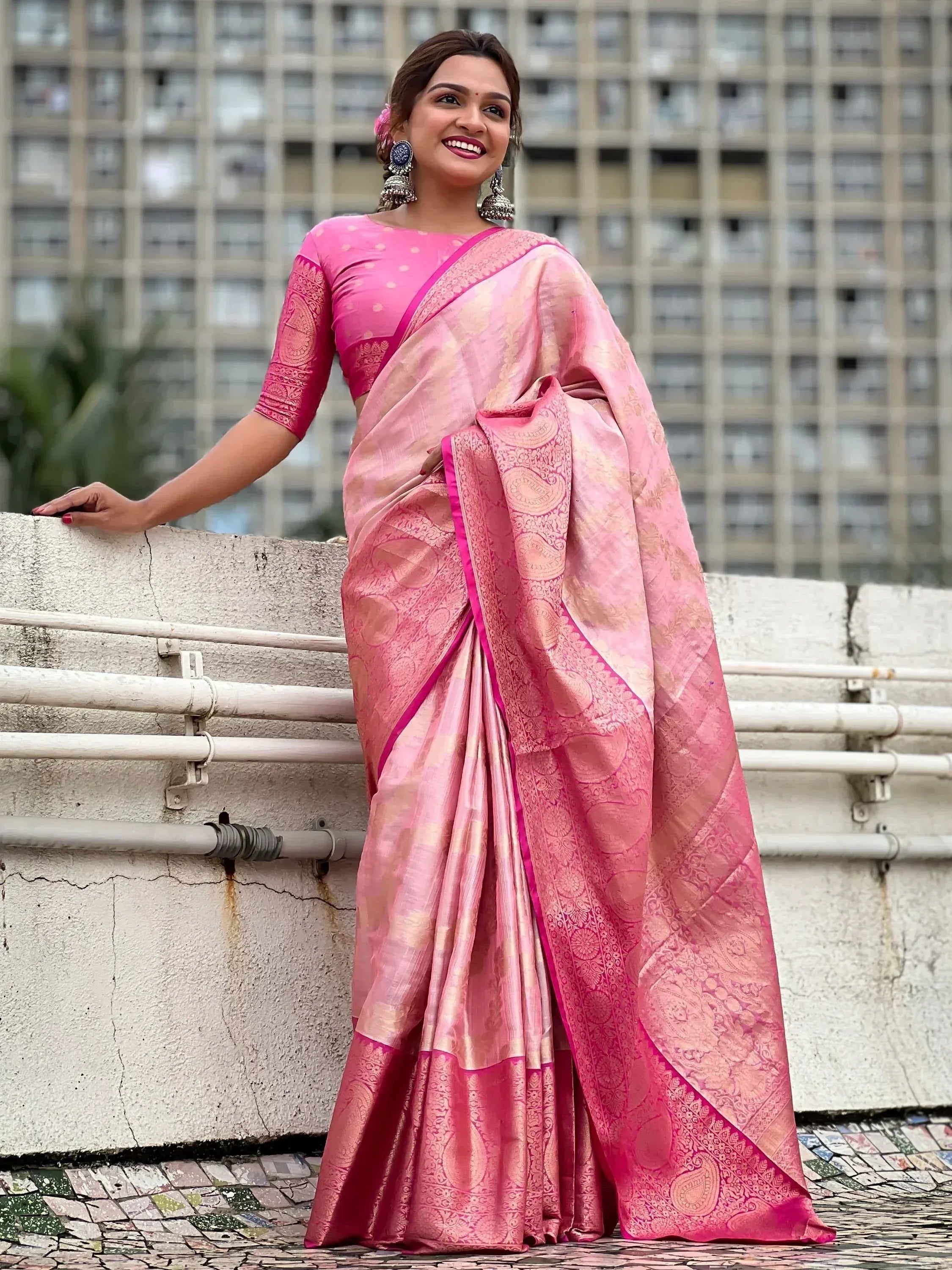 Pink designer saree with gold paisley print, paired with matching blouse, perfect for Indian ethnic wear