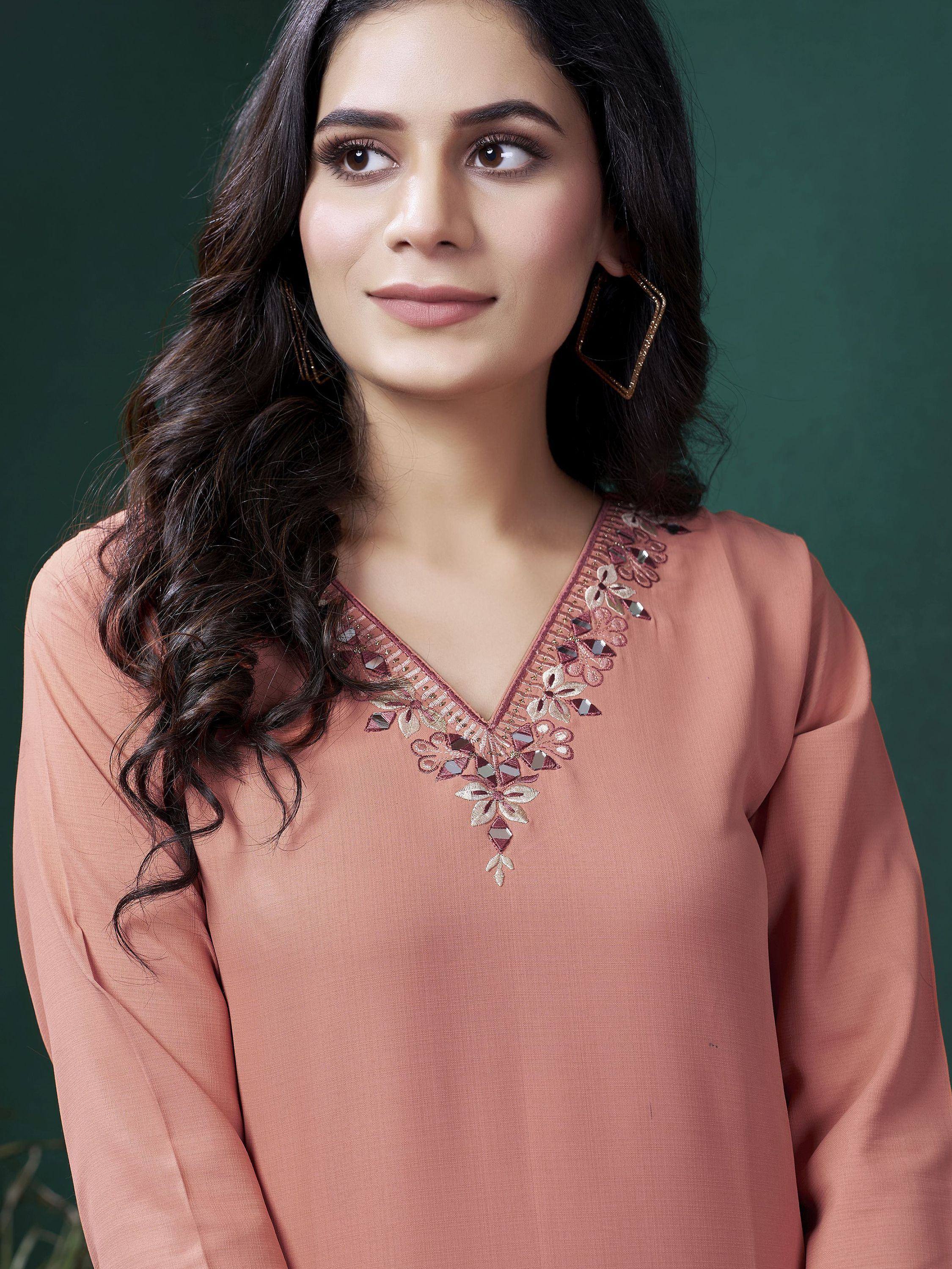 Dusty pink ethnic kurta with floral mirror embroidery and V-neck, styled with statement earrings