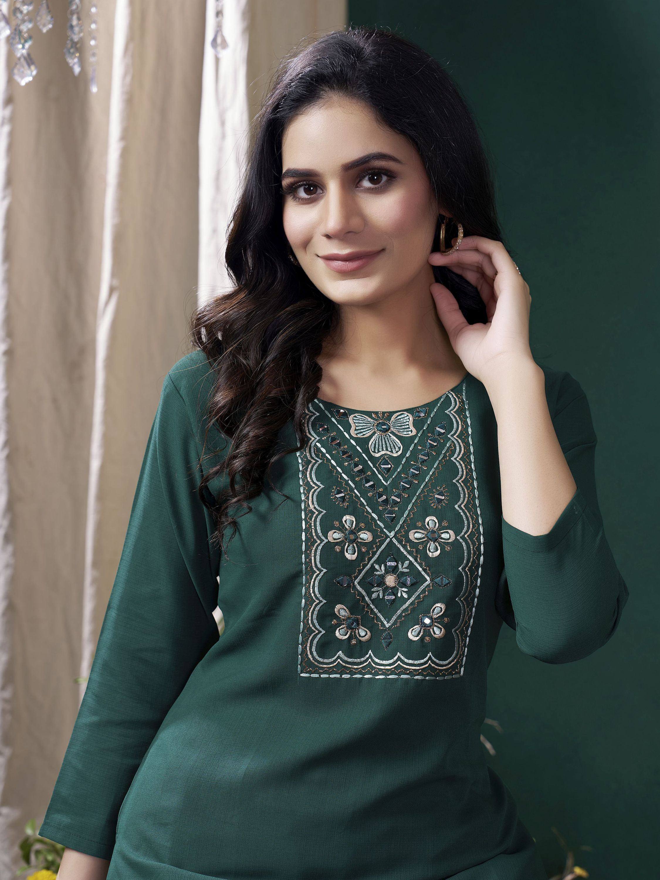 Green embroidered kurti with floral motifs, ideal for Indian ethnic wear and festive occasions.