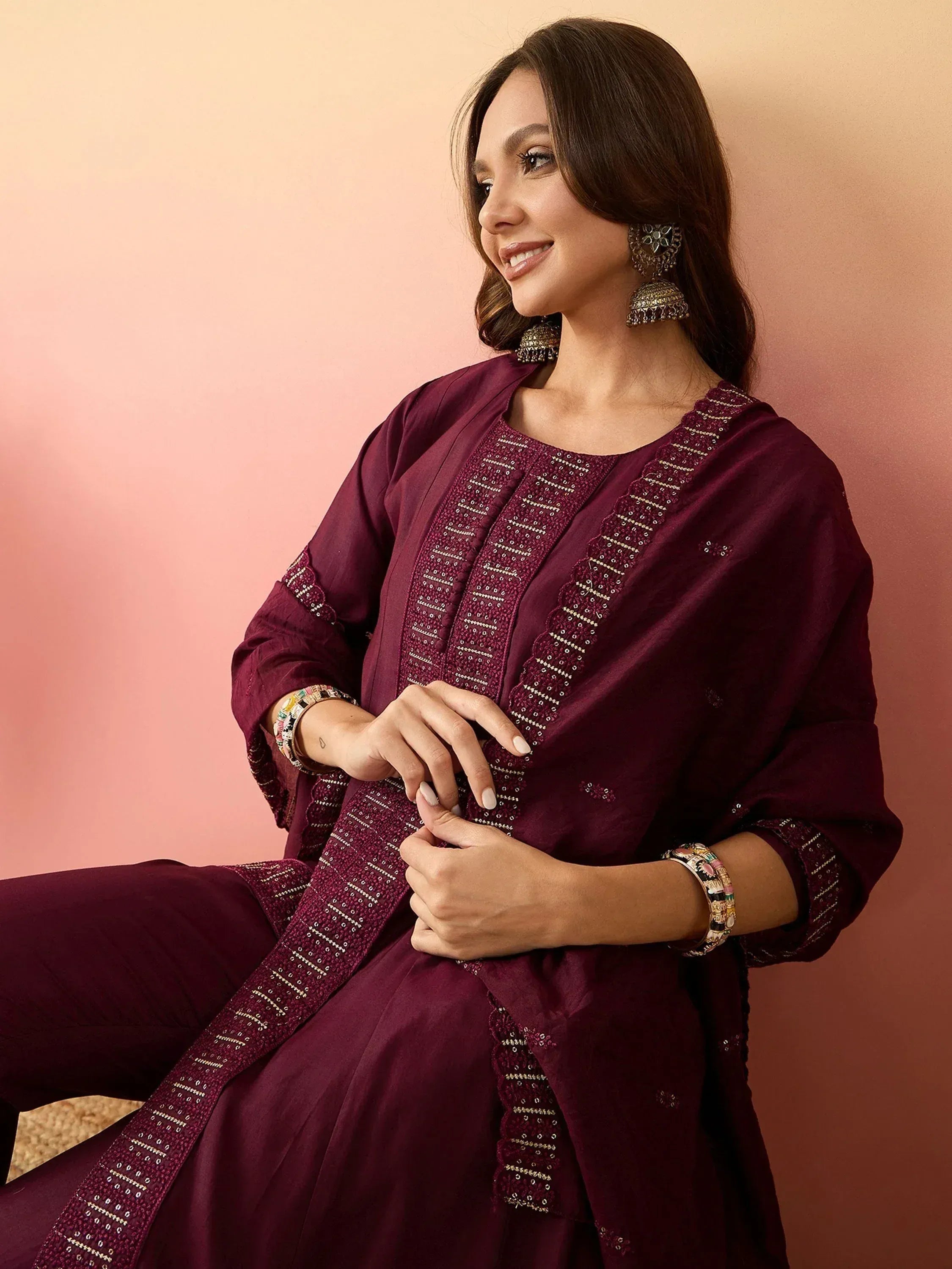 Elegant maroon ethnic kurti with intricate embroidery and matching palazzo pants