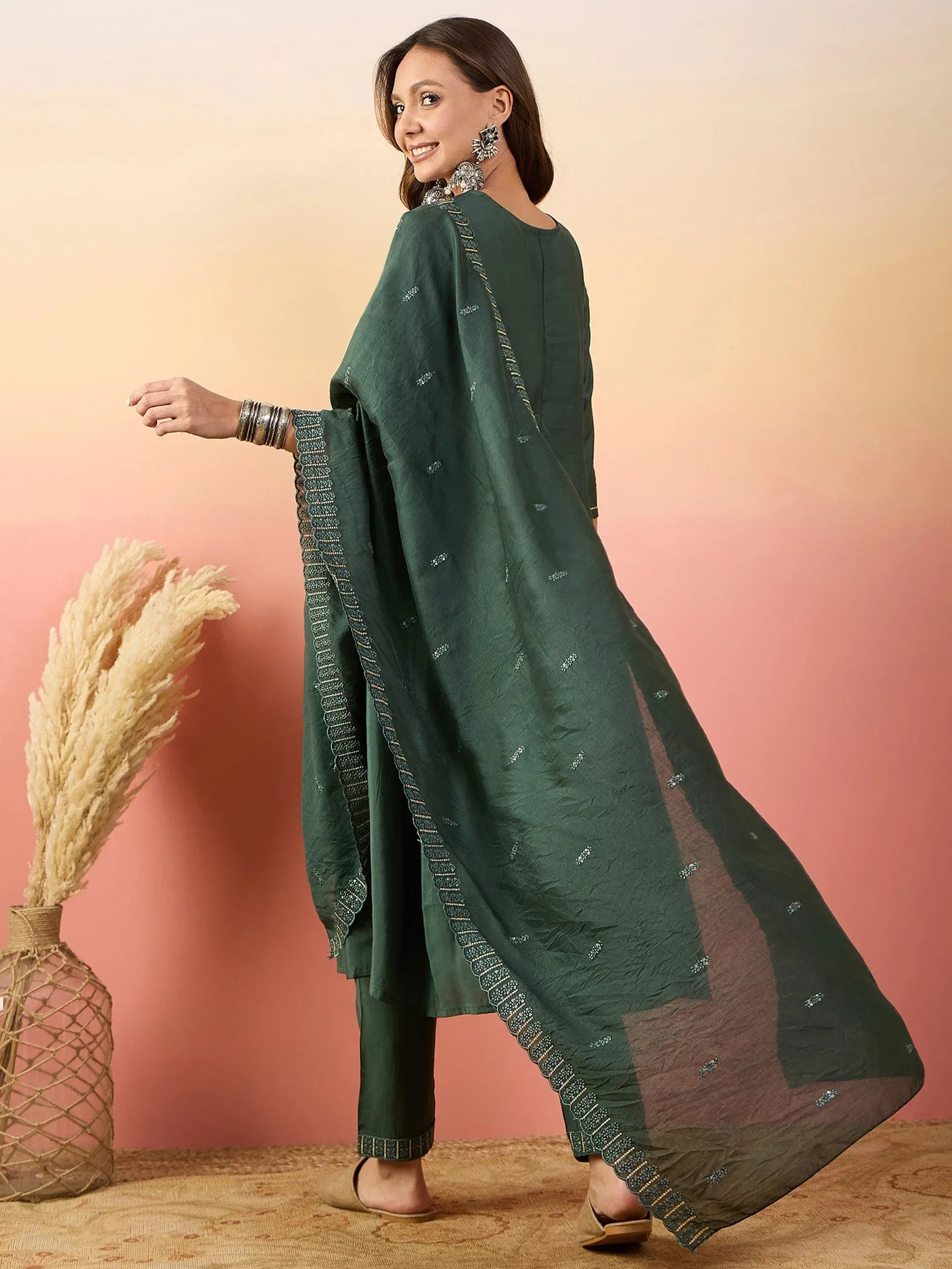 Elegant green ethnic salwar kameez with embroidered dupatta, perfect for festive occasions