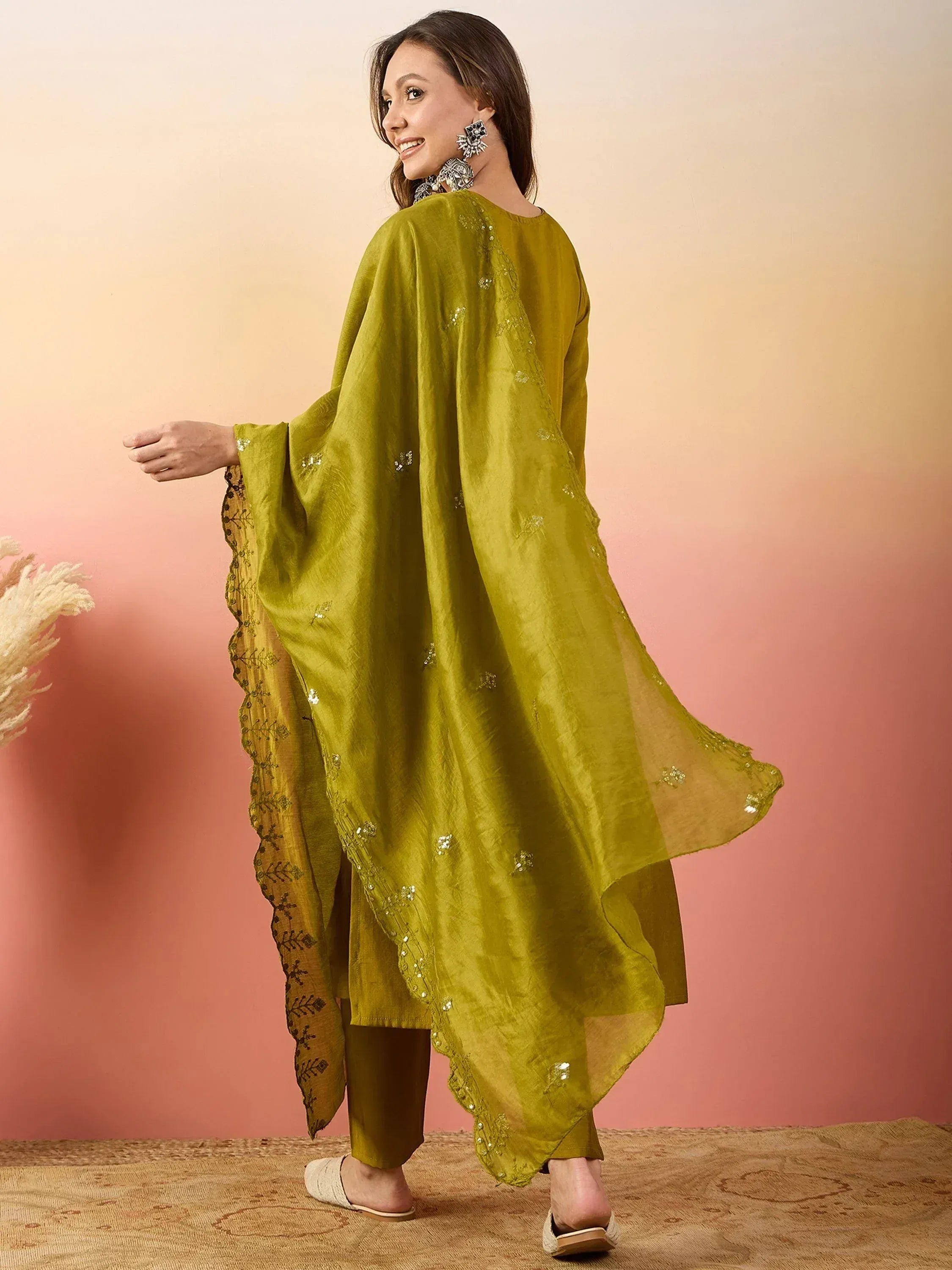 Olive green ethnic kurta with sequin embroidery and matching palazzo, styled with statement earrings