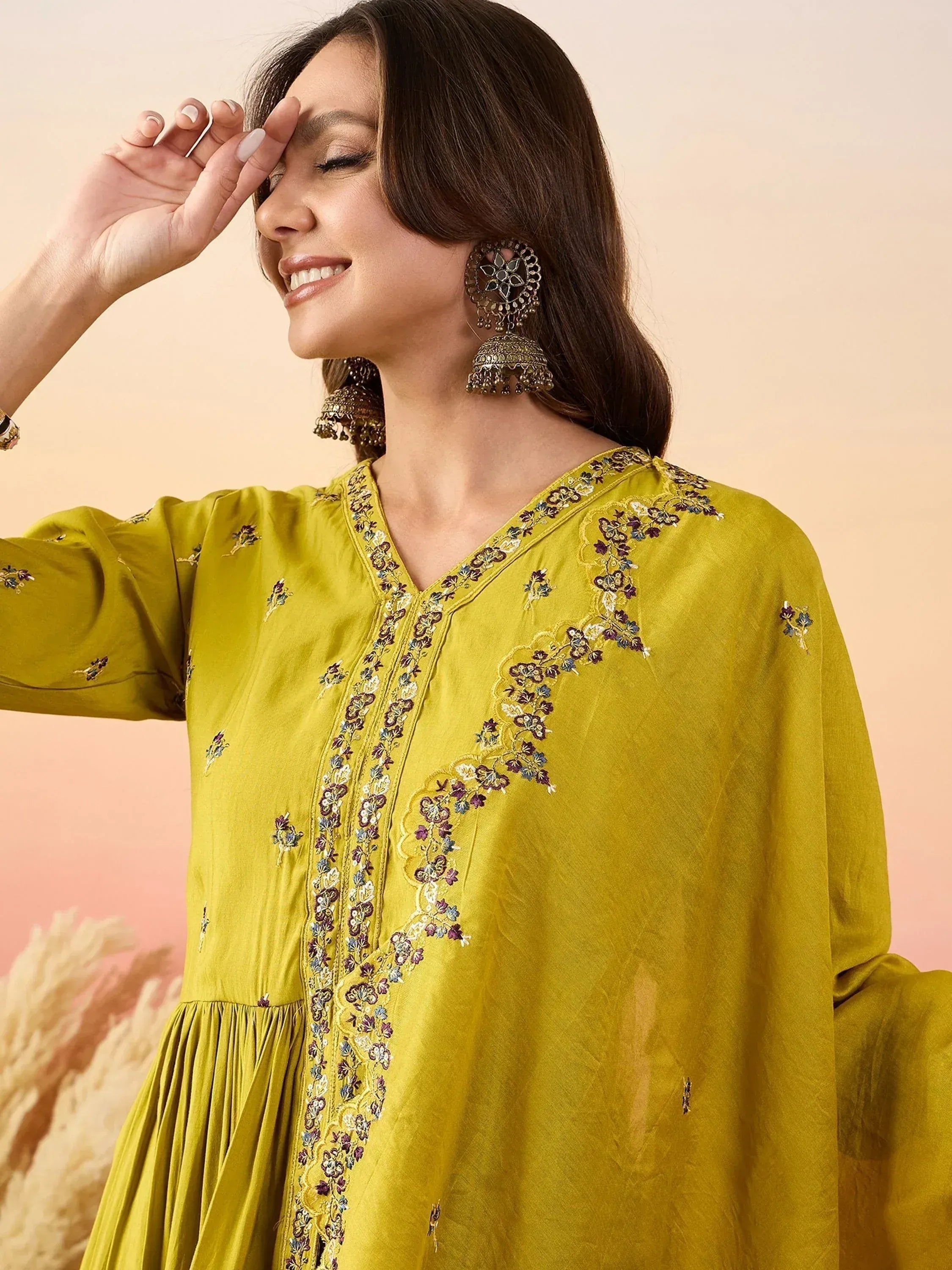 Yellow embroidered ethnic kurta with floral detailing and jhumka earrings for women