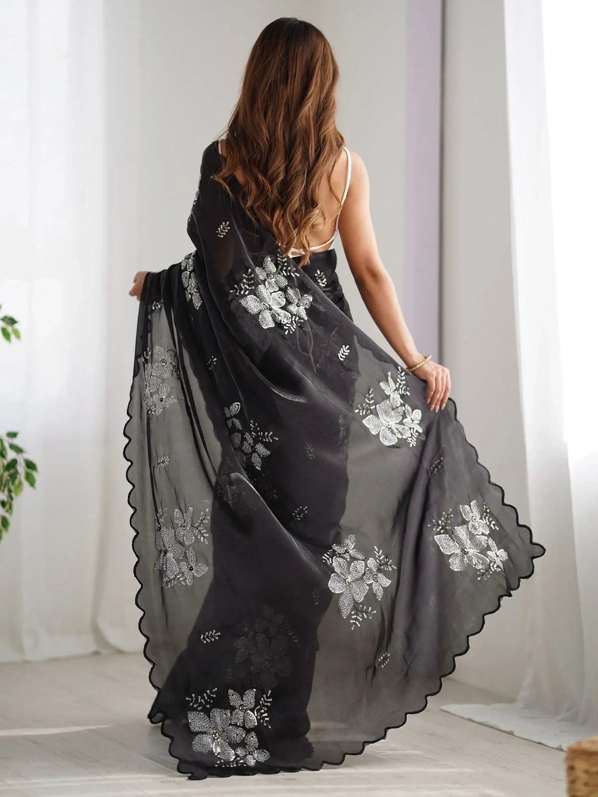 Black saree with silver floral embroidery and scalloped border, Indian ethnic wear