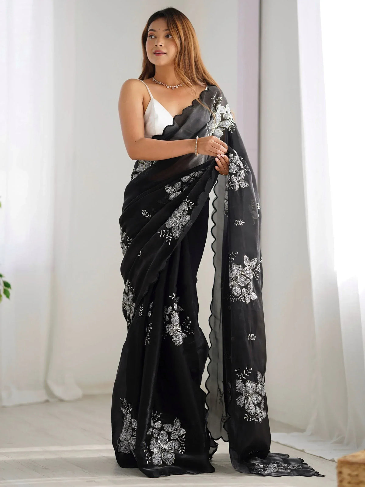 Black saree with silver floral embroidery, stylish ethnic wear for women