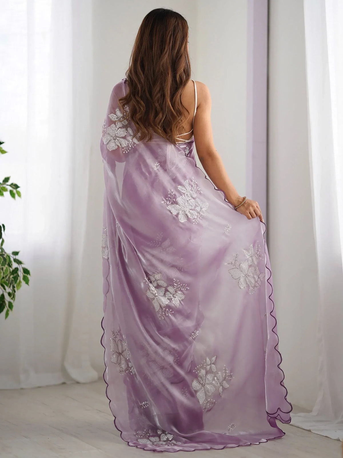 Lavender ethnic gown with floral embroidery, perfect for Indian occasions and festive wear.