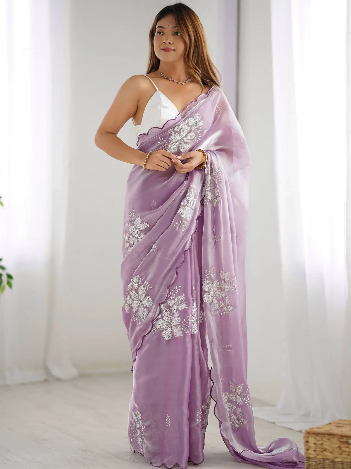 Lavender saree with white floral embroidery, styled with a white blouse for Indian ethnic wear.