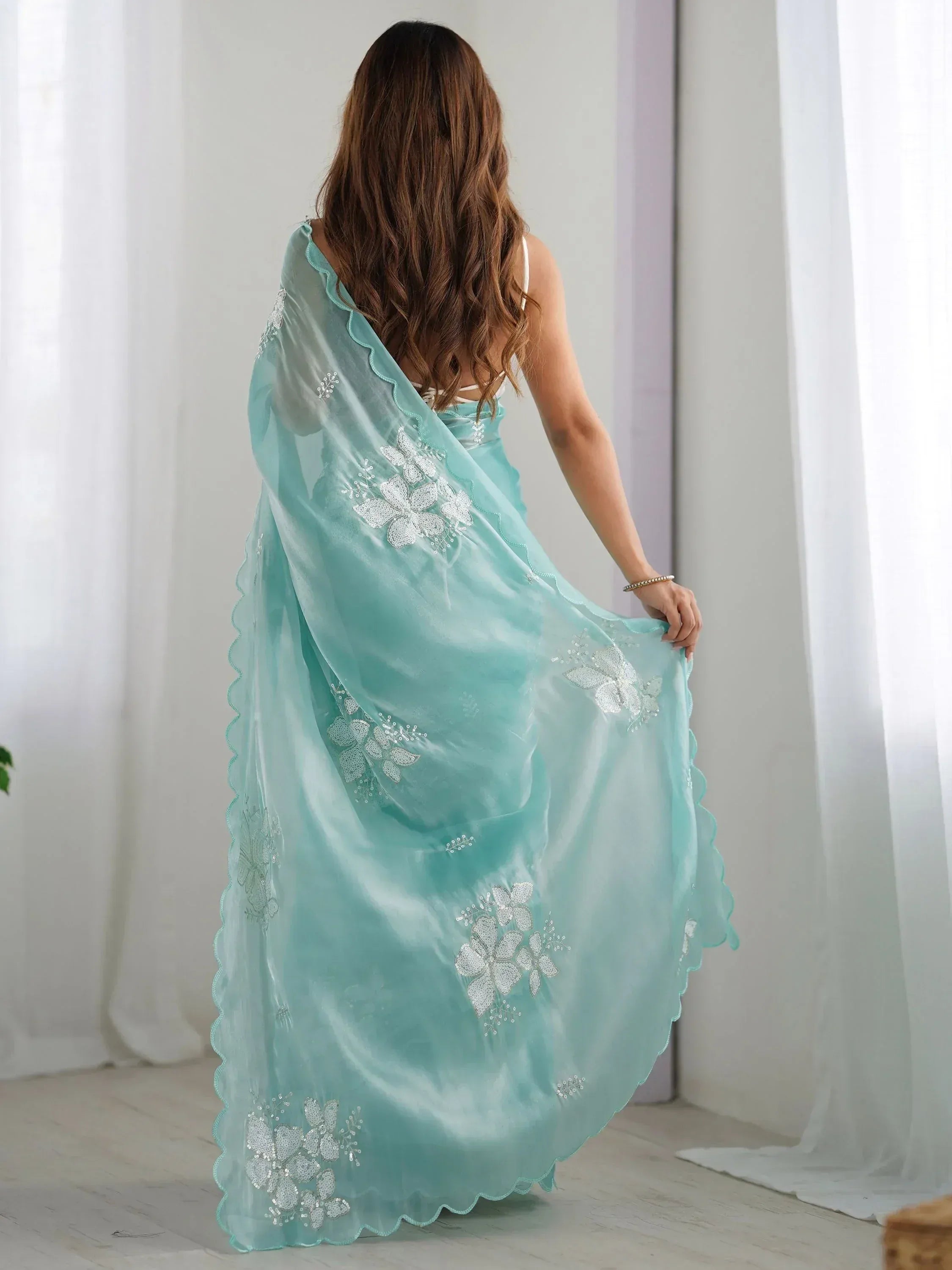 Mint green ethnic gown with silver floral embroidery and scalloped hem, perfect for Indian occasions