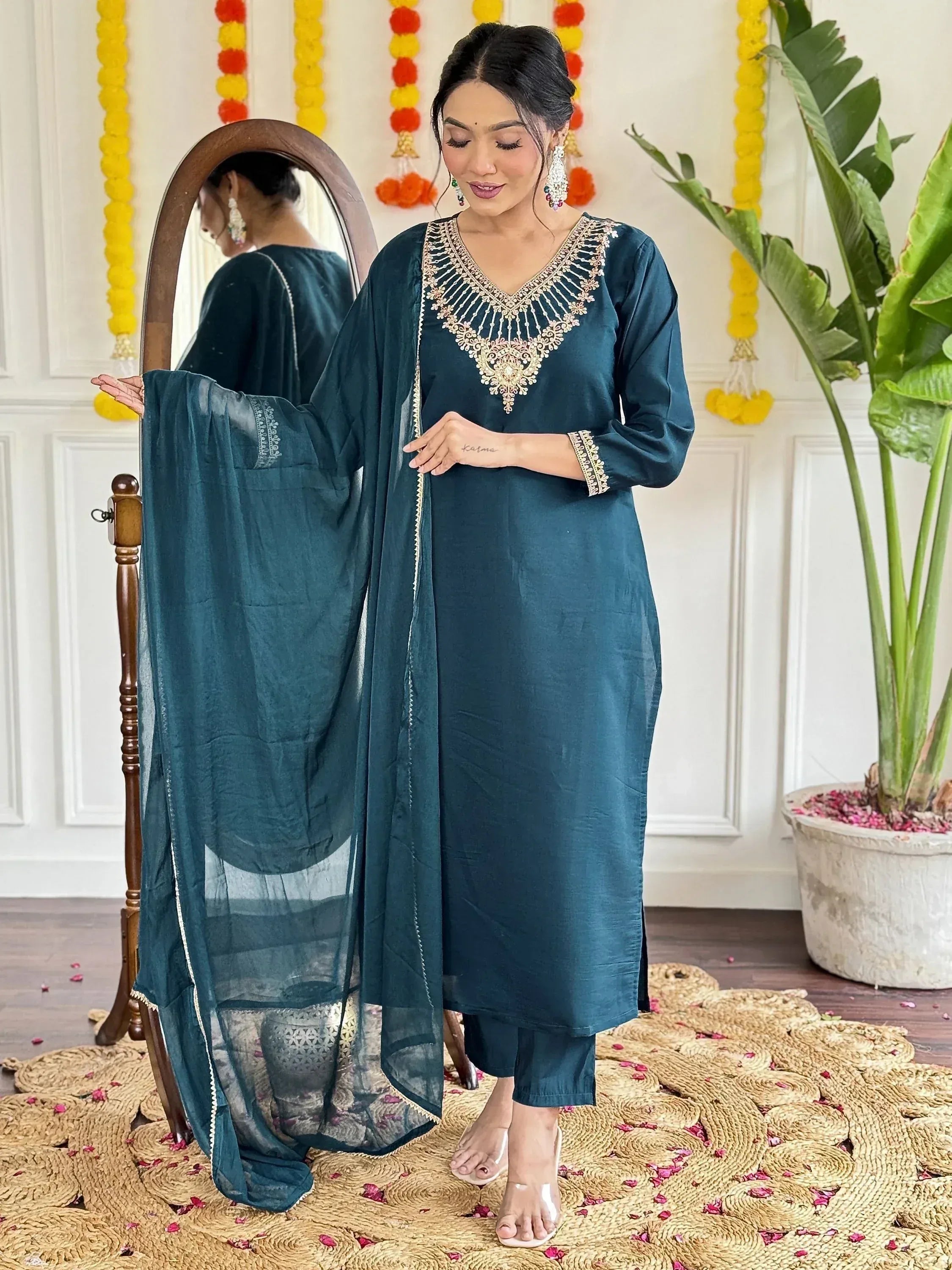Teal ethnic kurti with gold embroidery, matching dupatta, and palazzo pants for festive occasions