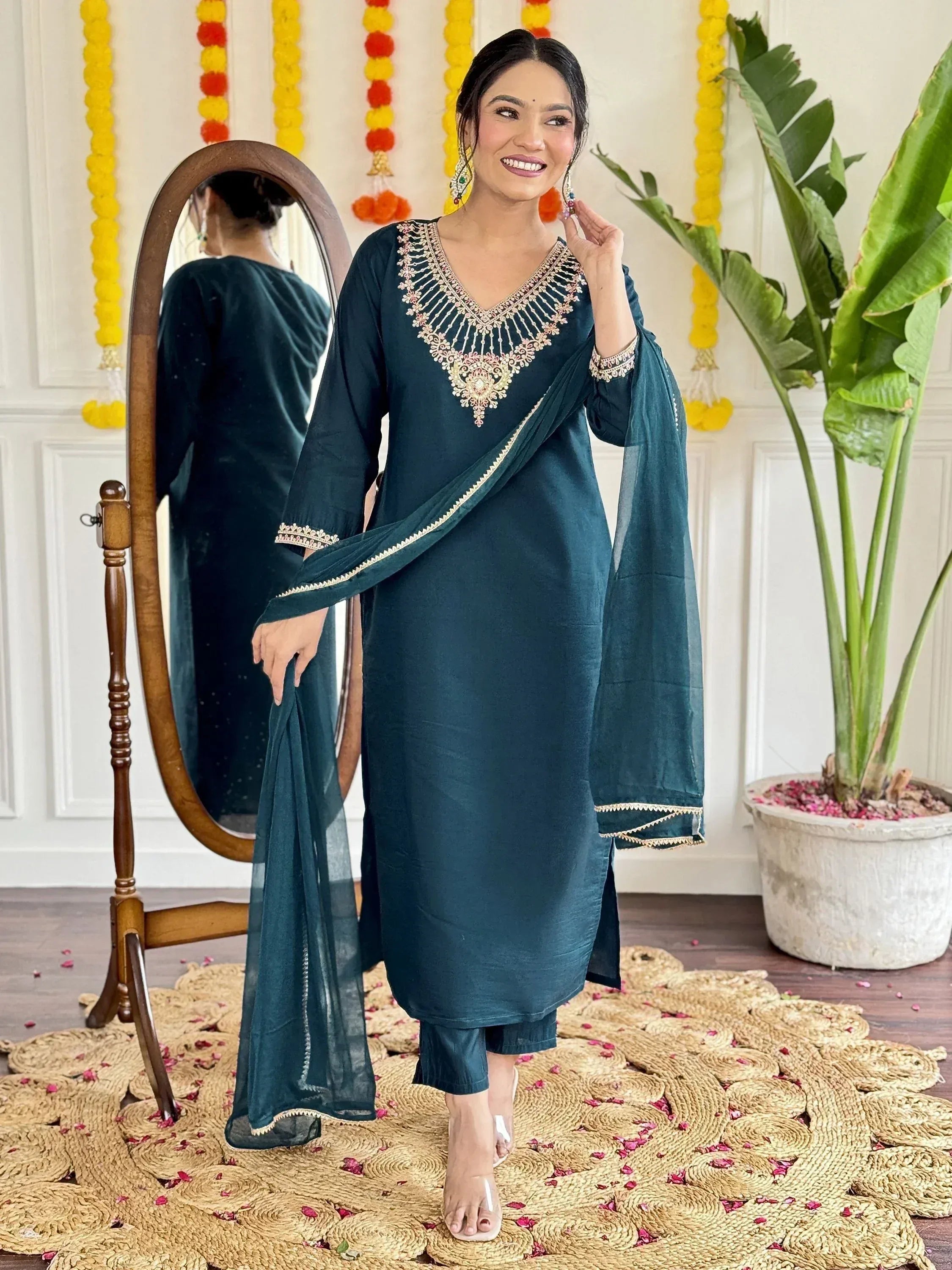 Teal ethnic salwar kameez with gold embroidery, perfect for Indian festive occasions and parties.