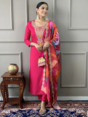 Woman in a pink embroidered salwar kameez with colorful dupatta, standing indoors, Ethnic Plus