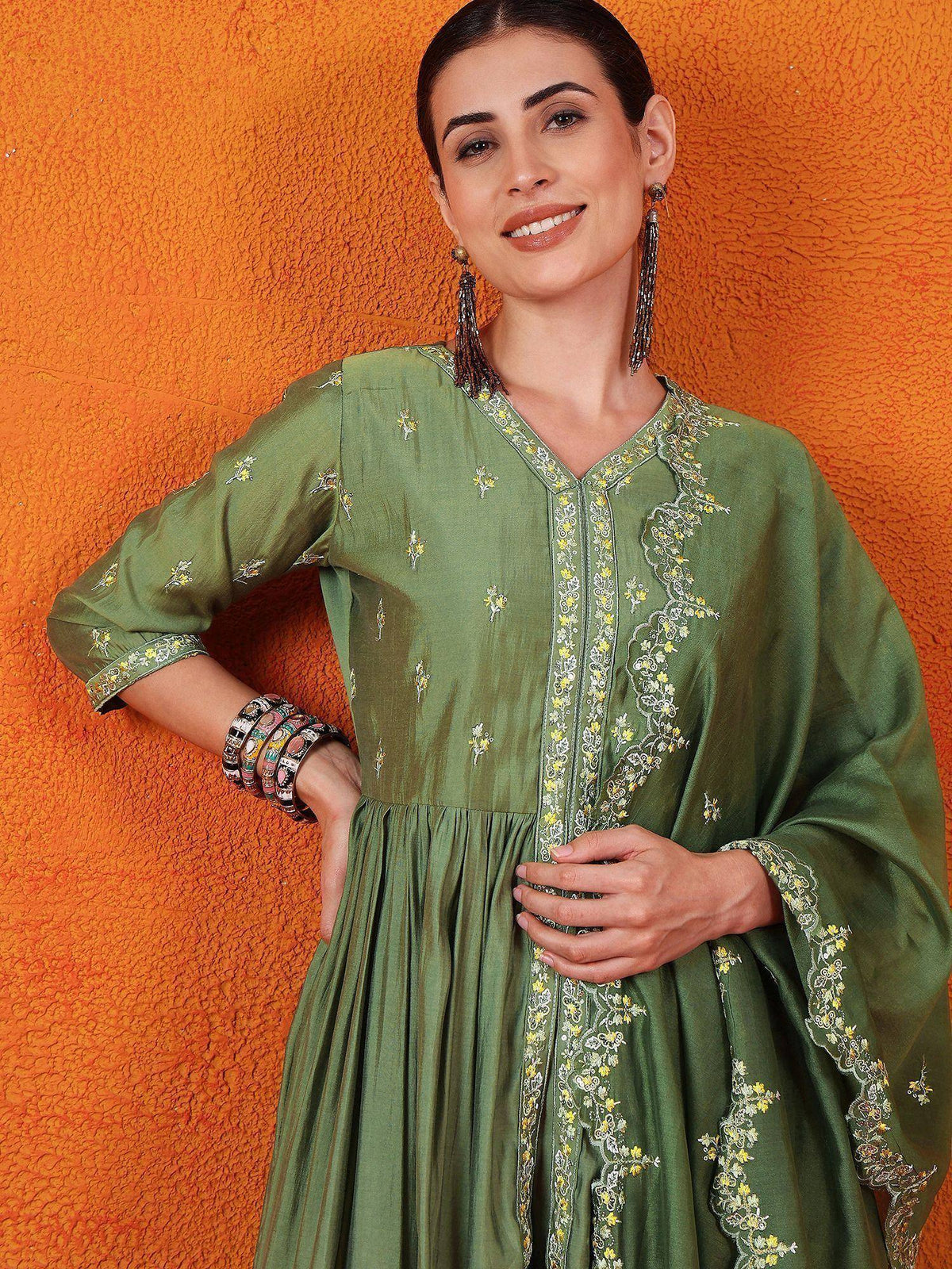 Green embroidered ethnic gown with floral detailing, perfect for Indian occasions and festive wear.