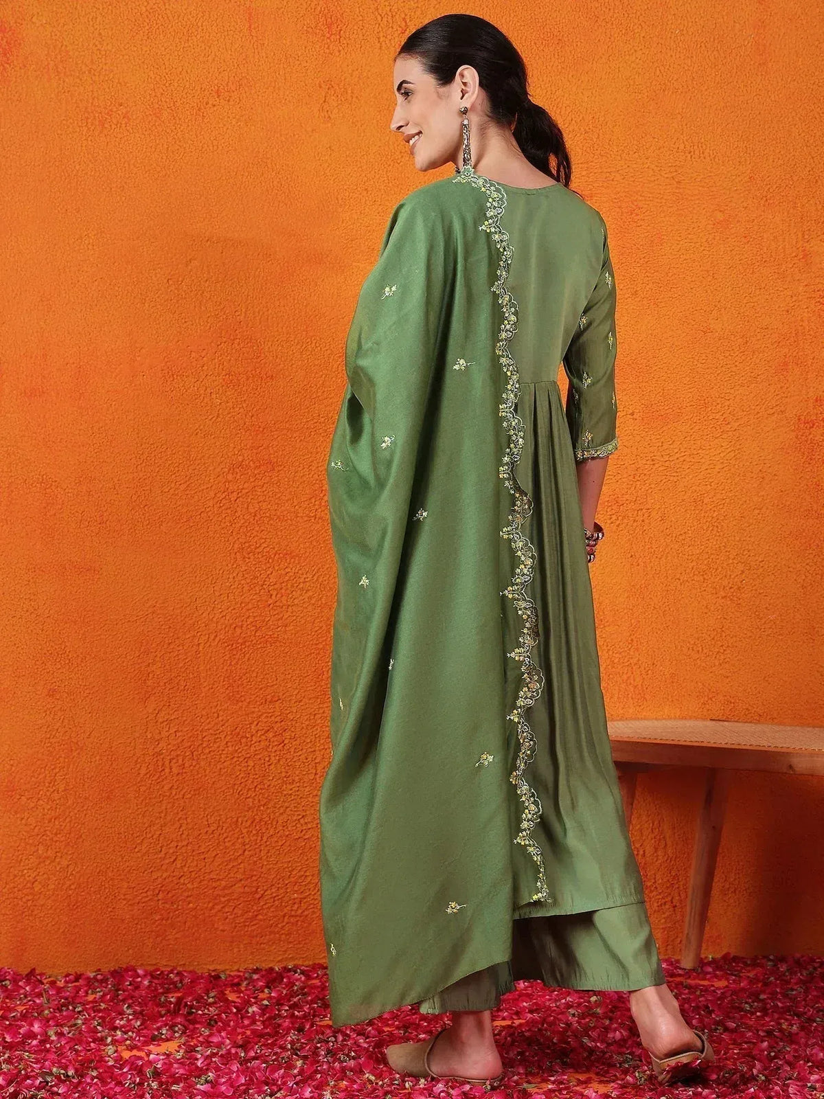 Green embroidered ethnic kurti with floral detailing, paired with matching pants, ideal for Indian wear.
