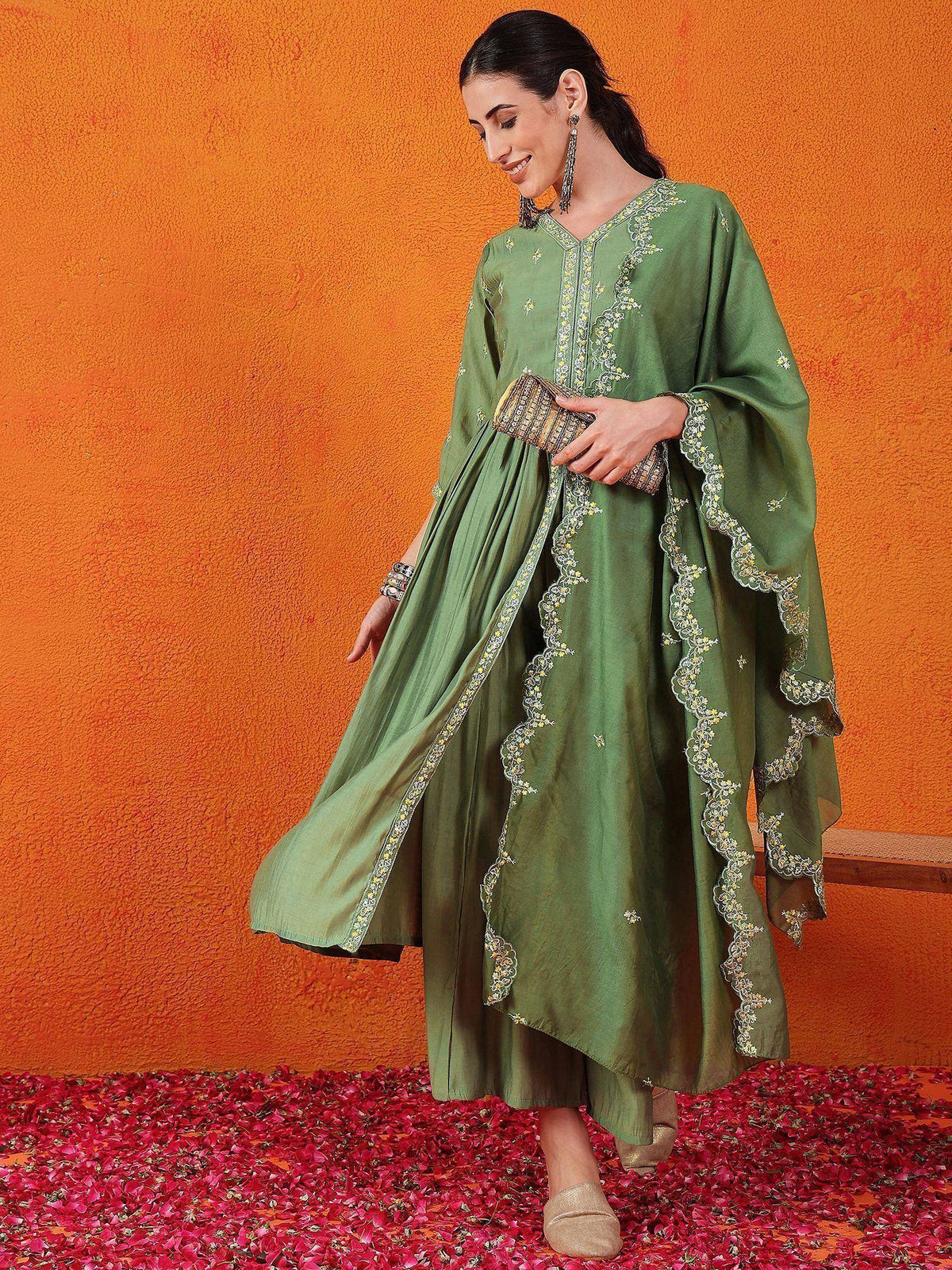 Green embroidered ethnic gown with floral detailing, perfect for Indian occasions and festive wear.