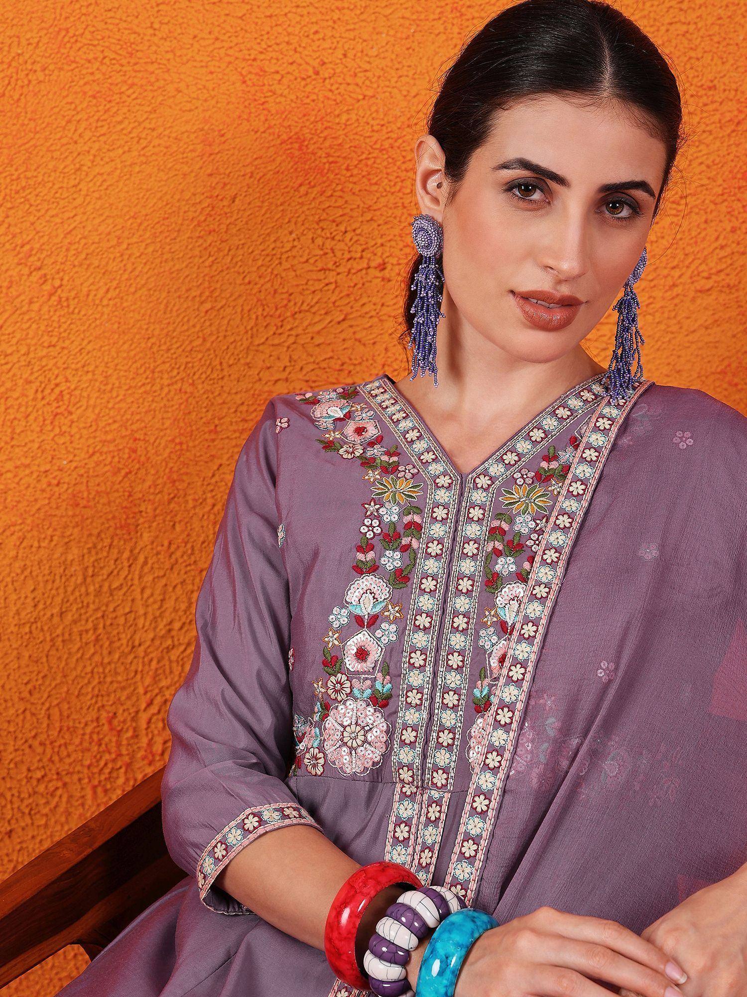 Purple embroidered kurta with floral detailing, paired with statement earrings and colorful bangles, perfect for ethnic occasions.