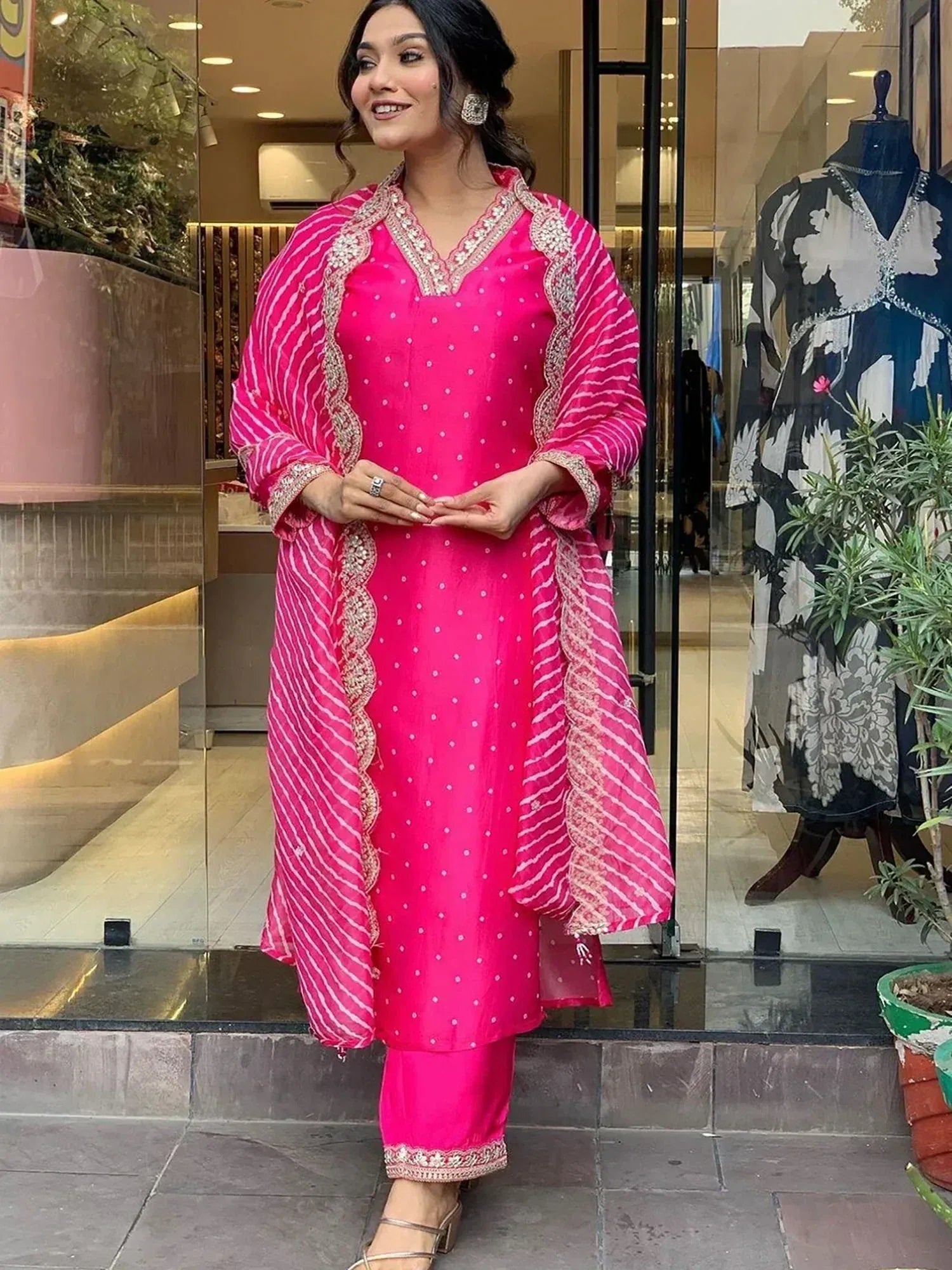 Pink ethnic salwar kameez with polka dots and embroidery, perfect for festive occasions