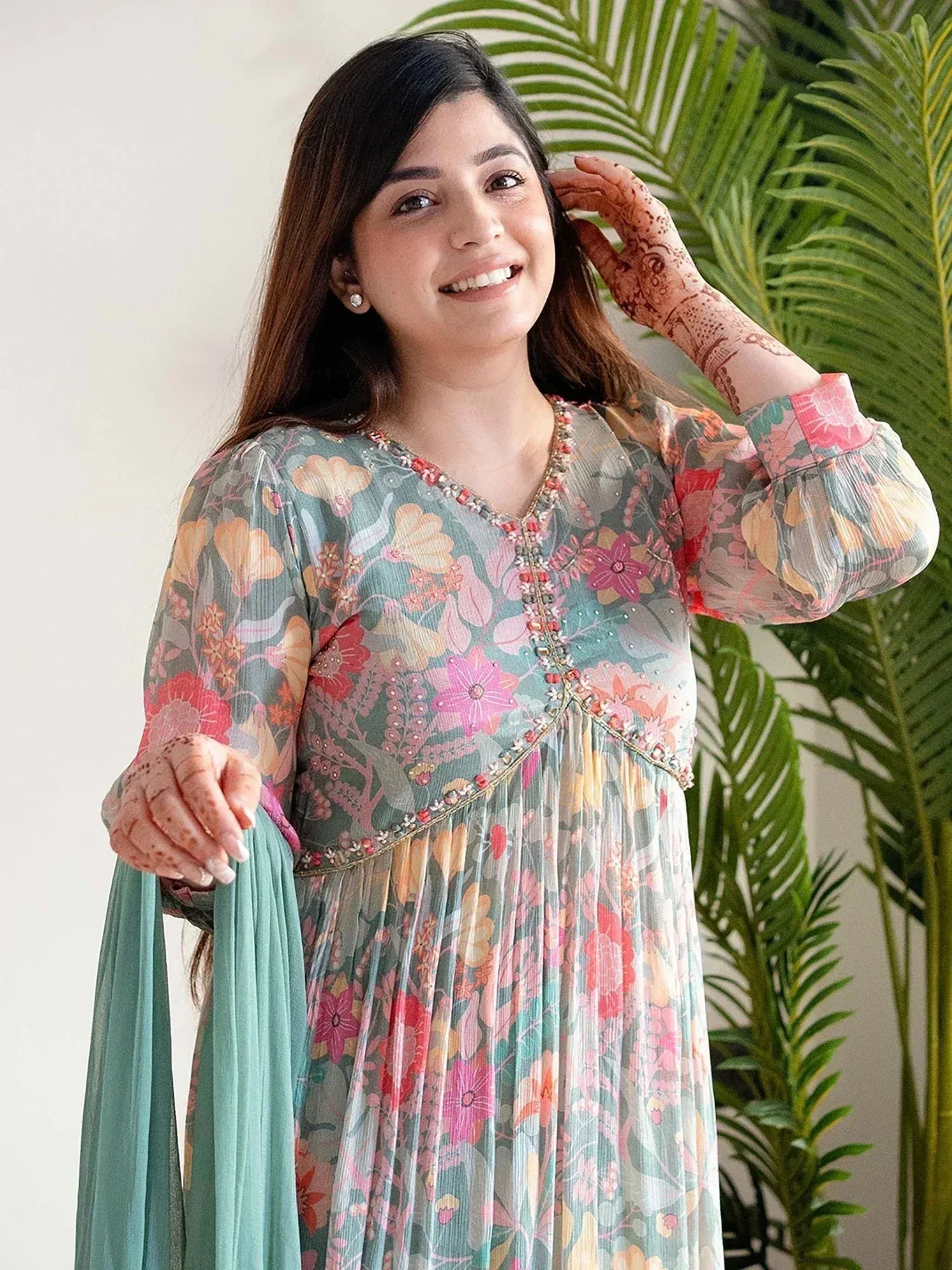 Floral printed ethnic gown with embroidery, paired with matching dupatta, ideal for festive occasions.