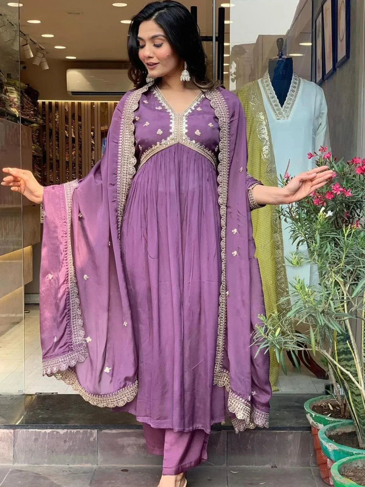Woman wearing mauve embroidered salwar kameez with dupatta, traditional Indian ethnic wear