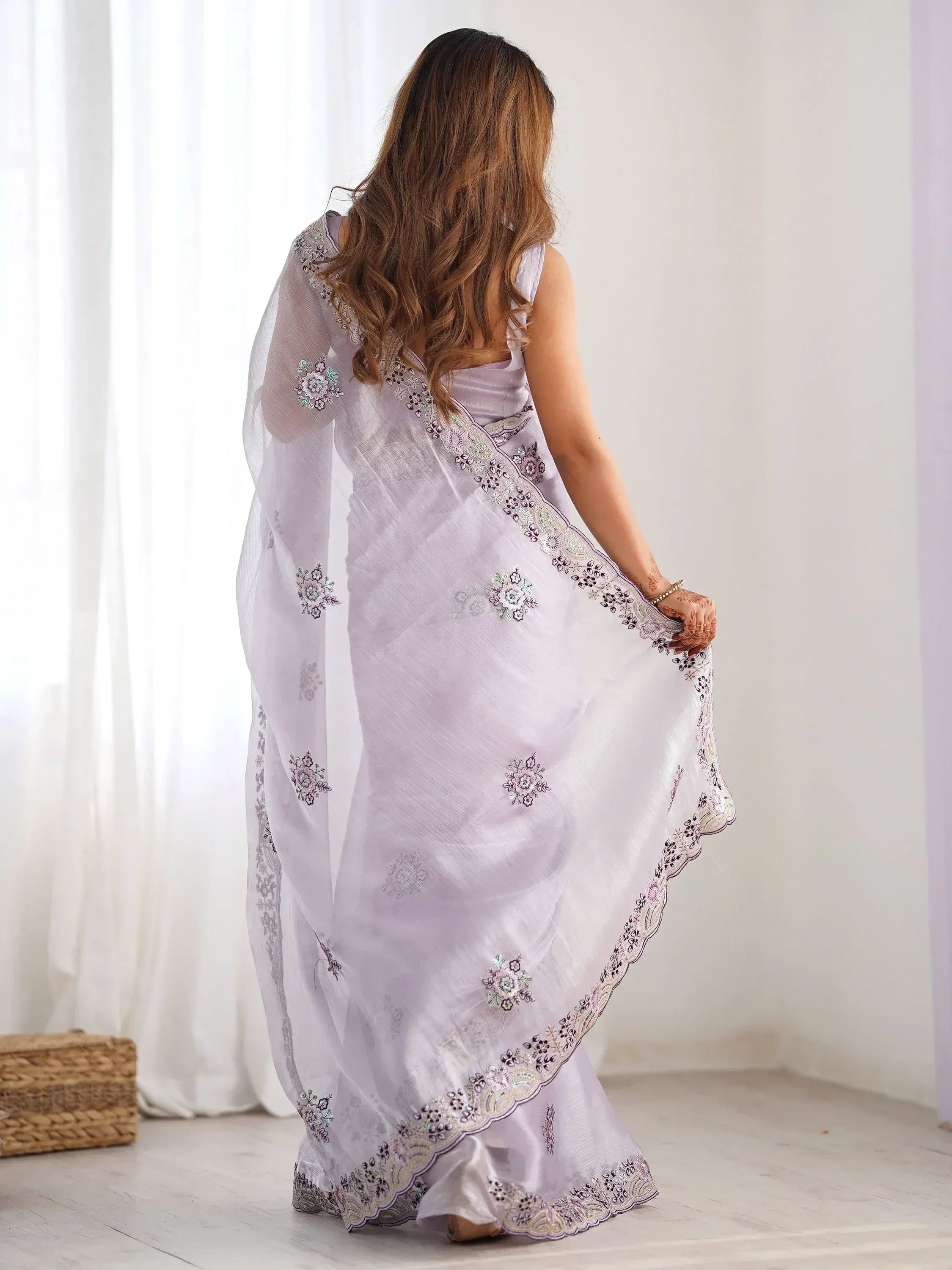 Lavender embroidered saree with floral motifs, perfect for Indian ethnic wear occasions
